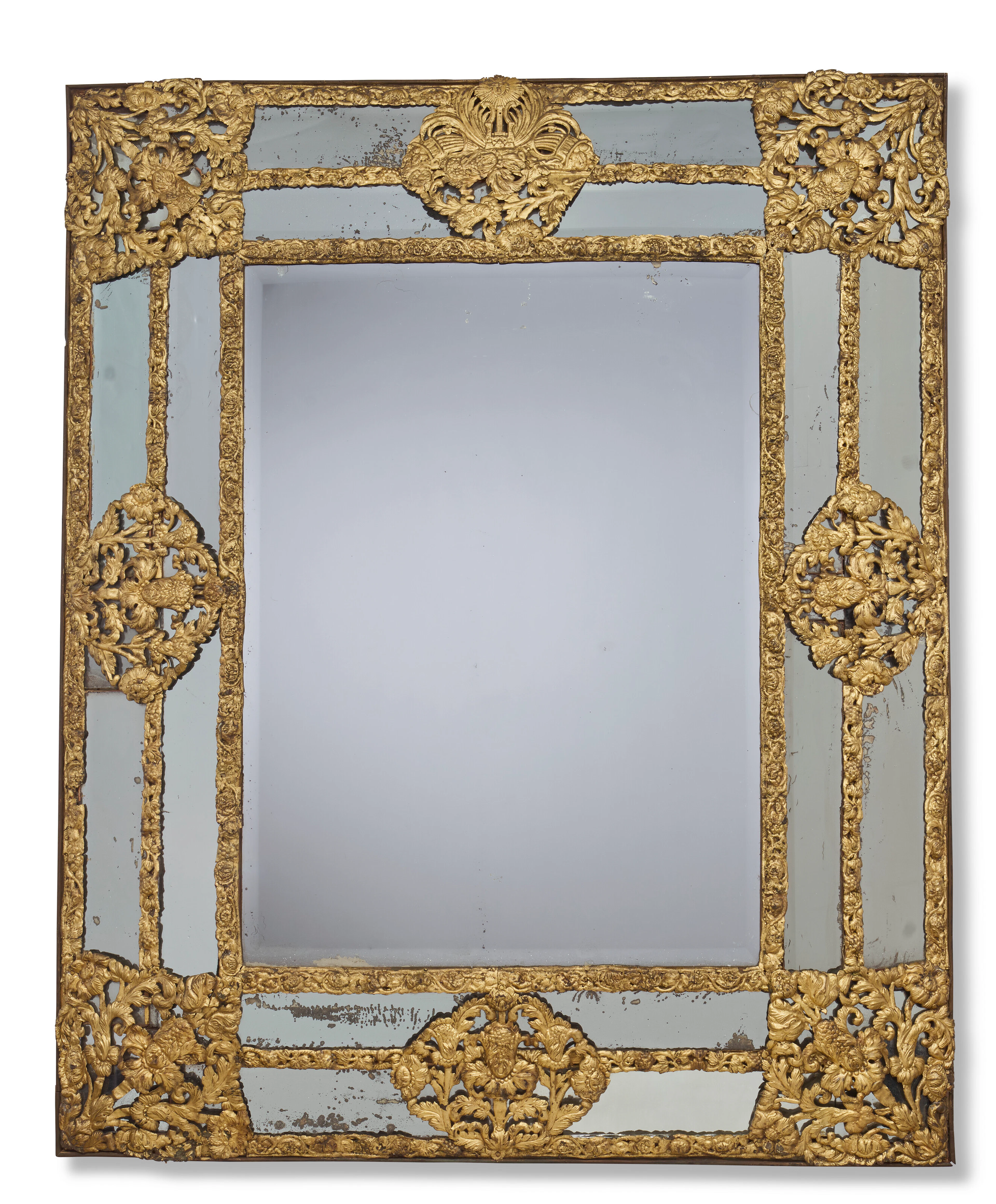 A Flemish Gilt Repousse Metal-Mounted Mirror