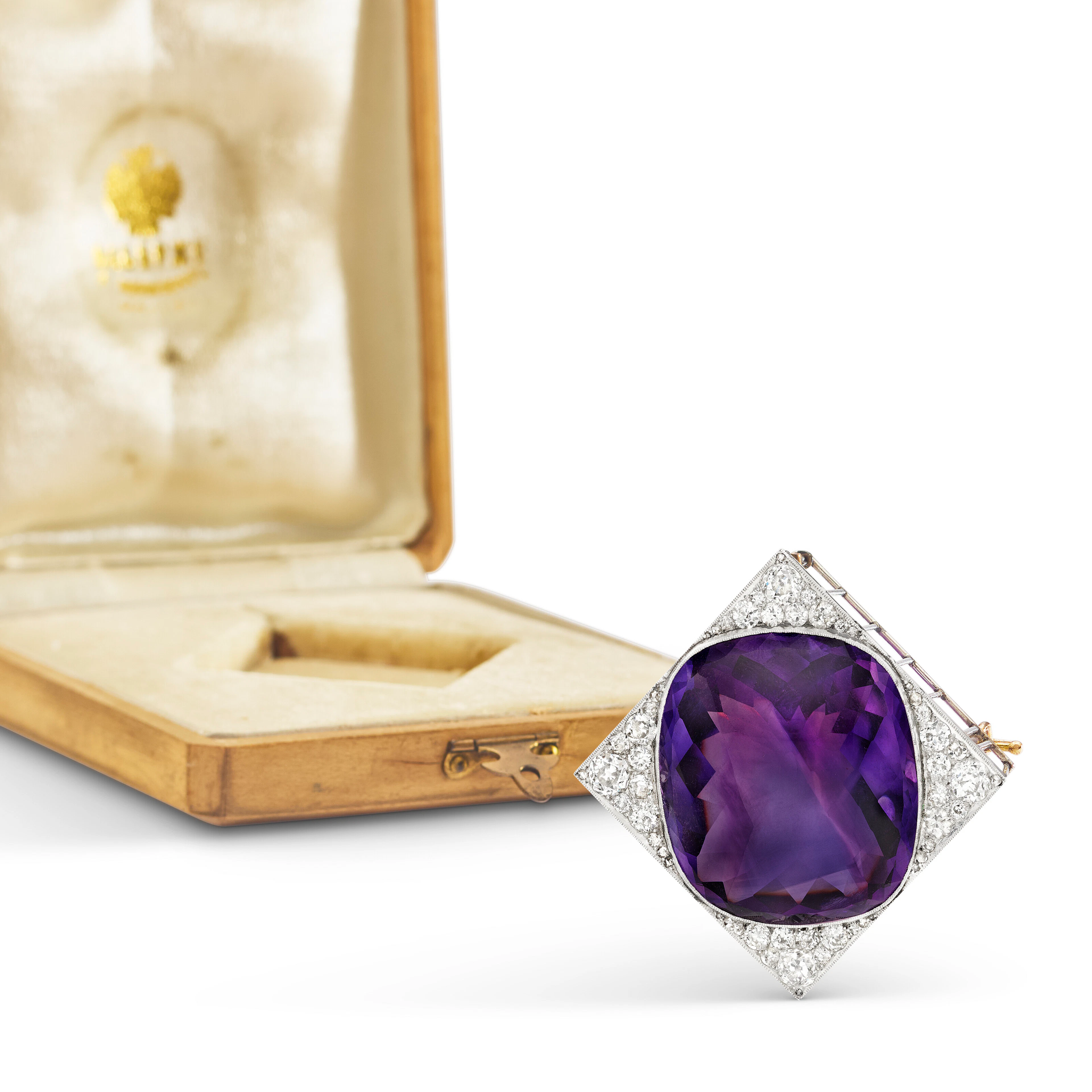 An Amethyst and Diamond Gold and Platinum Brooch