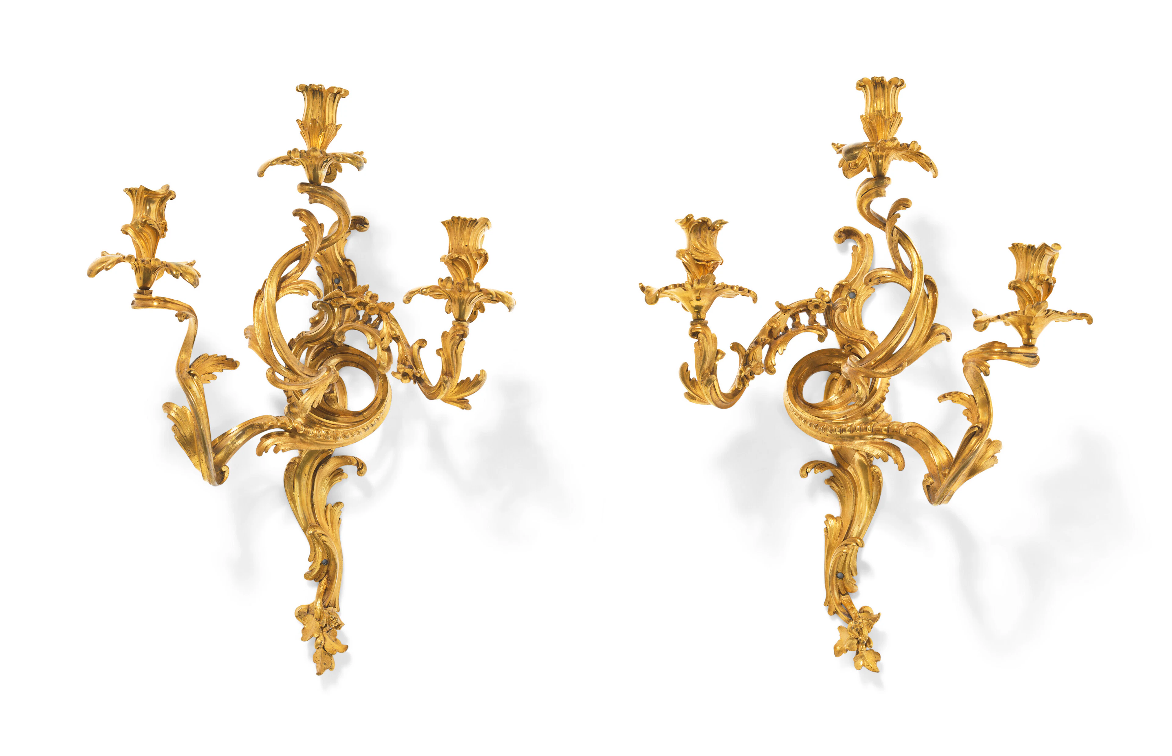 A PAIR OF EARLY LOUIS XV ORMOLU THREE-BRANCH WALL-LIGHTS