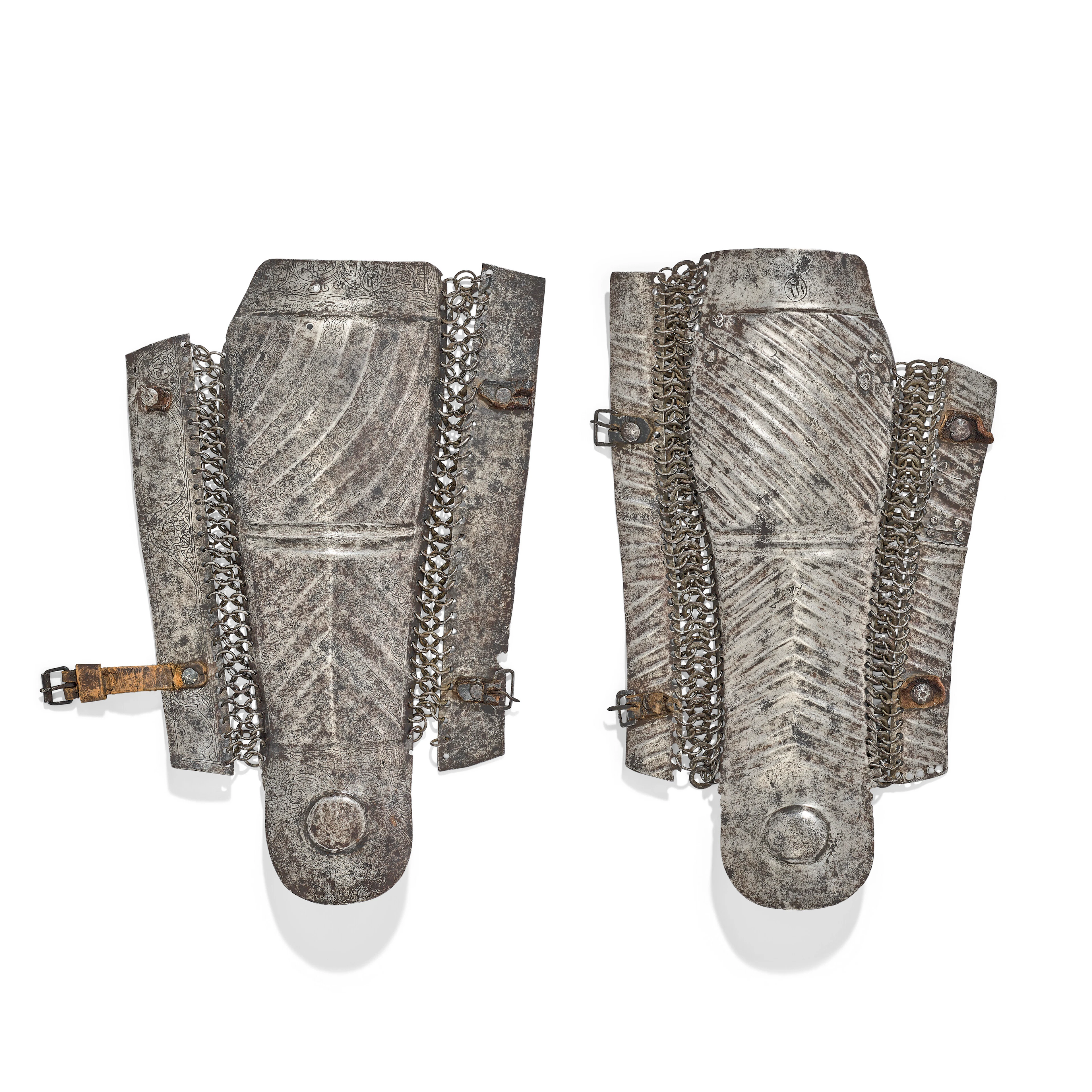 TWO FINE CAVALRYMAN’S LEG GUARDS