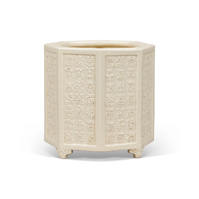 A Moulded White-Glazed Soft-Paste ' Shou ' Octagonal Brush Pot