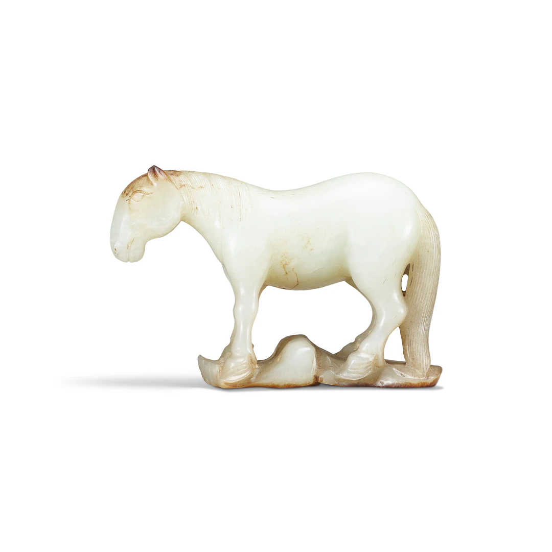 A Rare Small Greenish-White and Russet Jade Carving of a Standing Horse