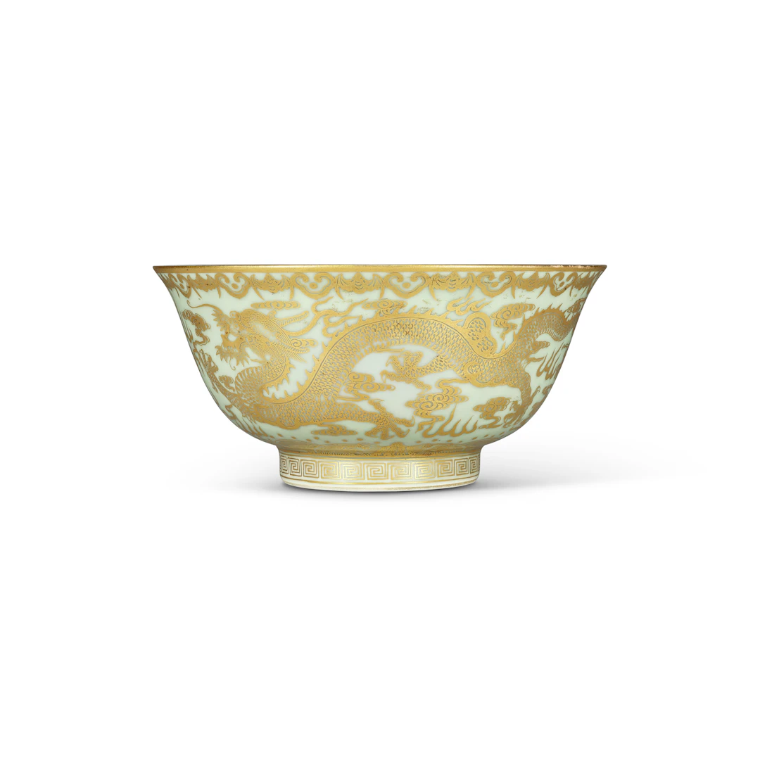 A Rare Gilt-Decorated Celadon-Glazed Ground ‘Dragon’ Bowl