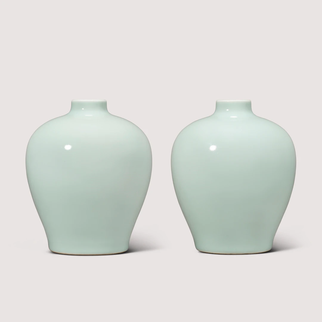 A Fine and Rare Pair of Celadon-Glazed Jars