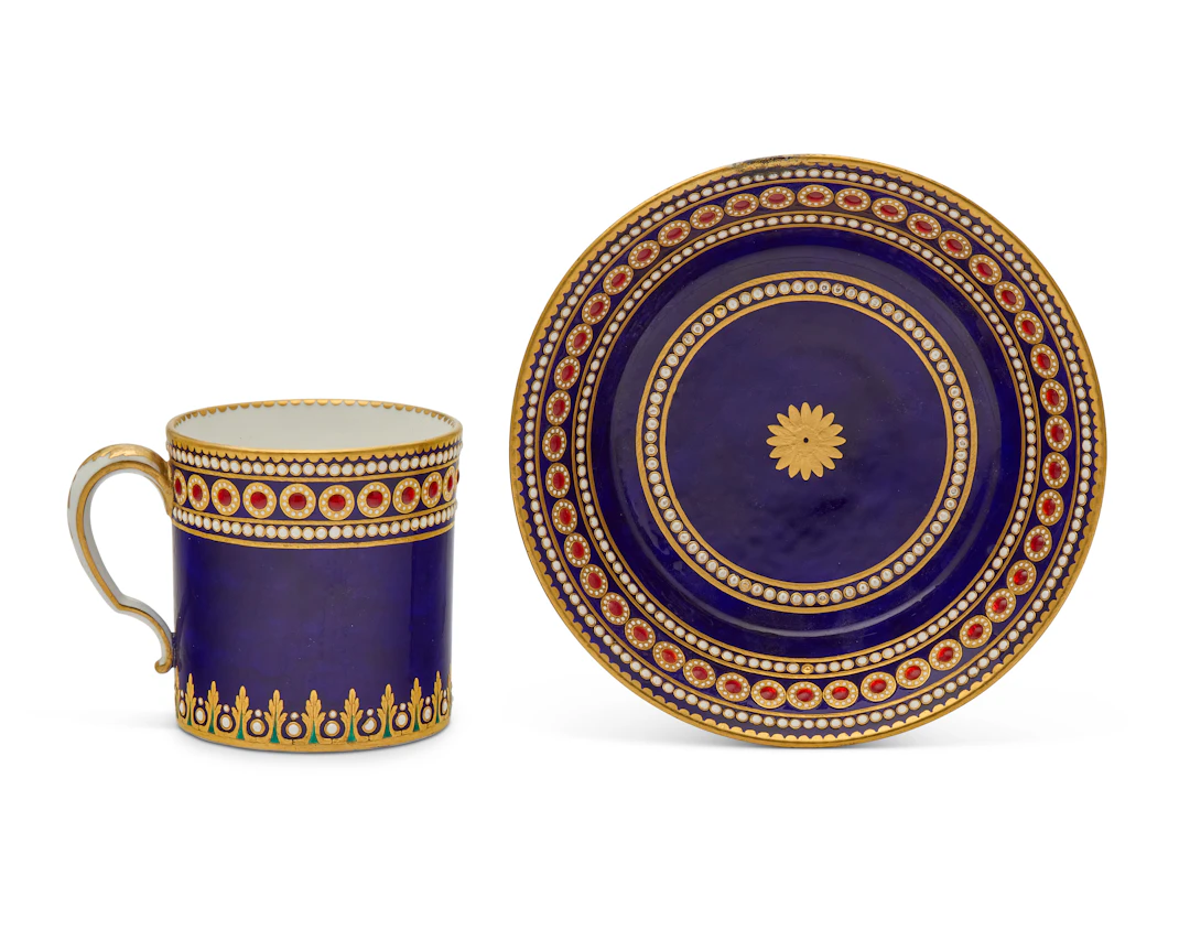 A Sevres Porcelain 'Bleu Nouveau' 'Jeweled' Cup and Saucer (Gobelet