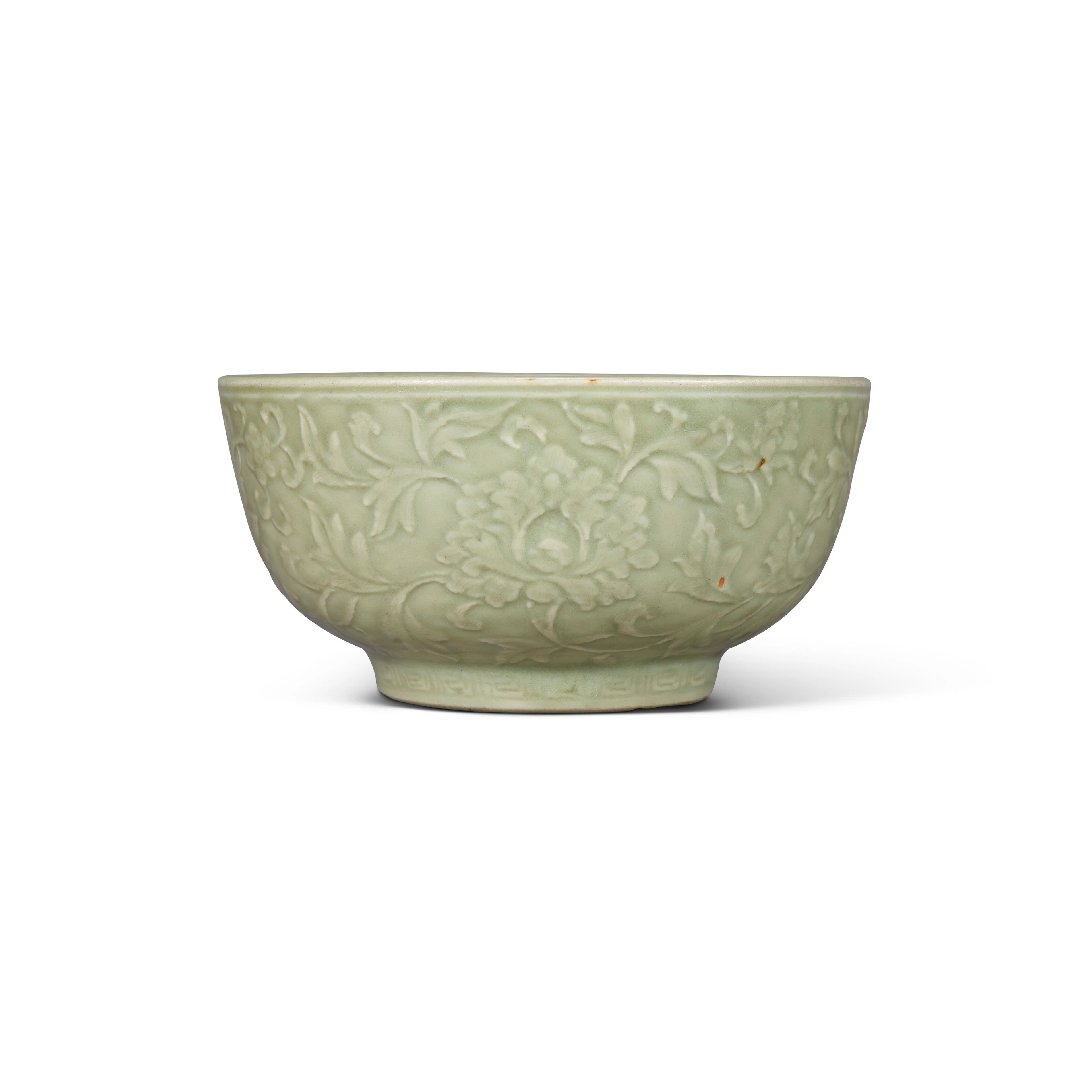 A Large Carved Longquan Celadon ‘Flowers of the Four Seasons’ Bowl