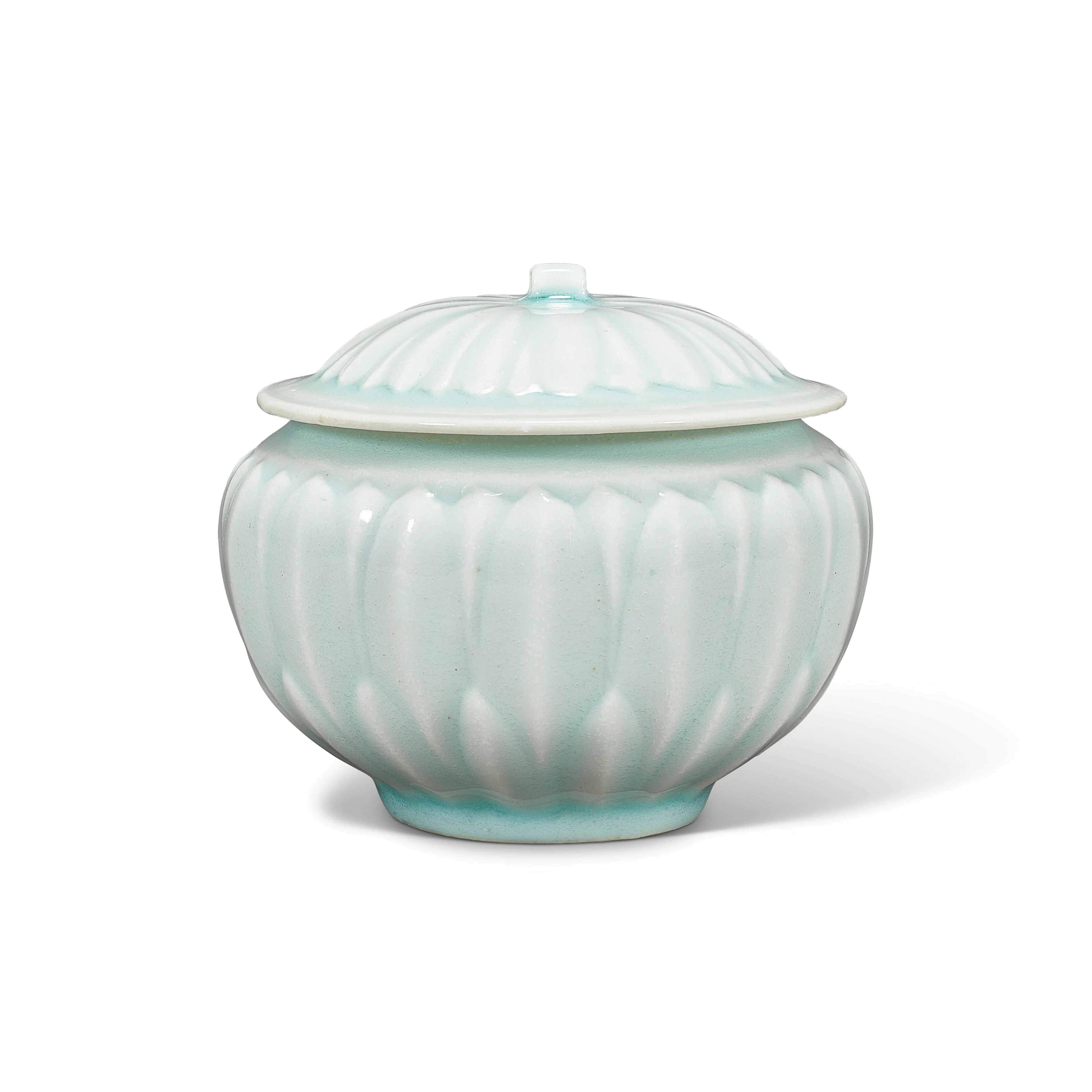 A Carved Small Qingbai 'Lotus' Jar and Cover