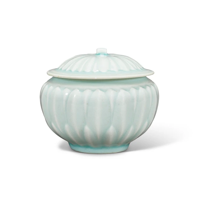 A Carved Small Qingbai 'Lotus' Jar and Cover