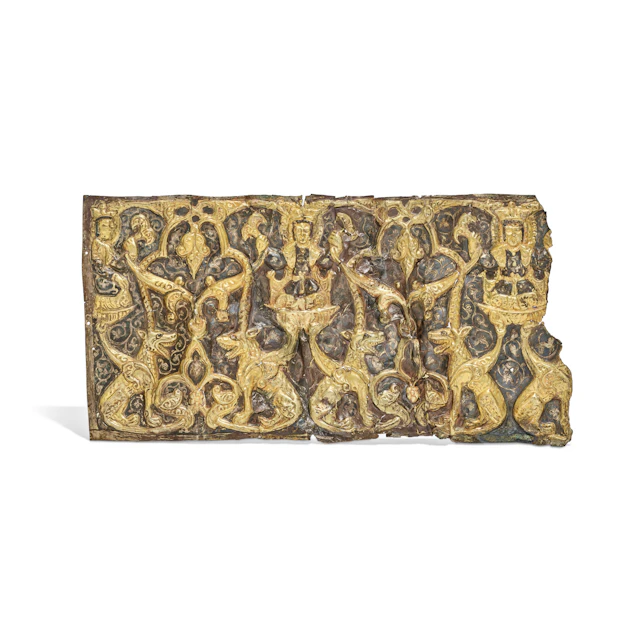 A Ghurid Repoussé Parcel-Gilt and Niello Silver Panel