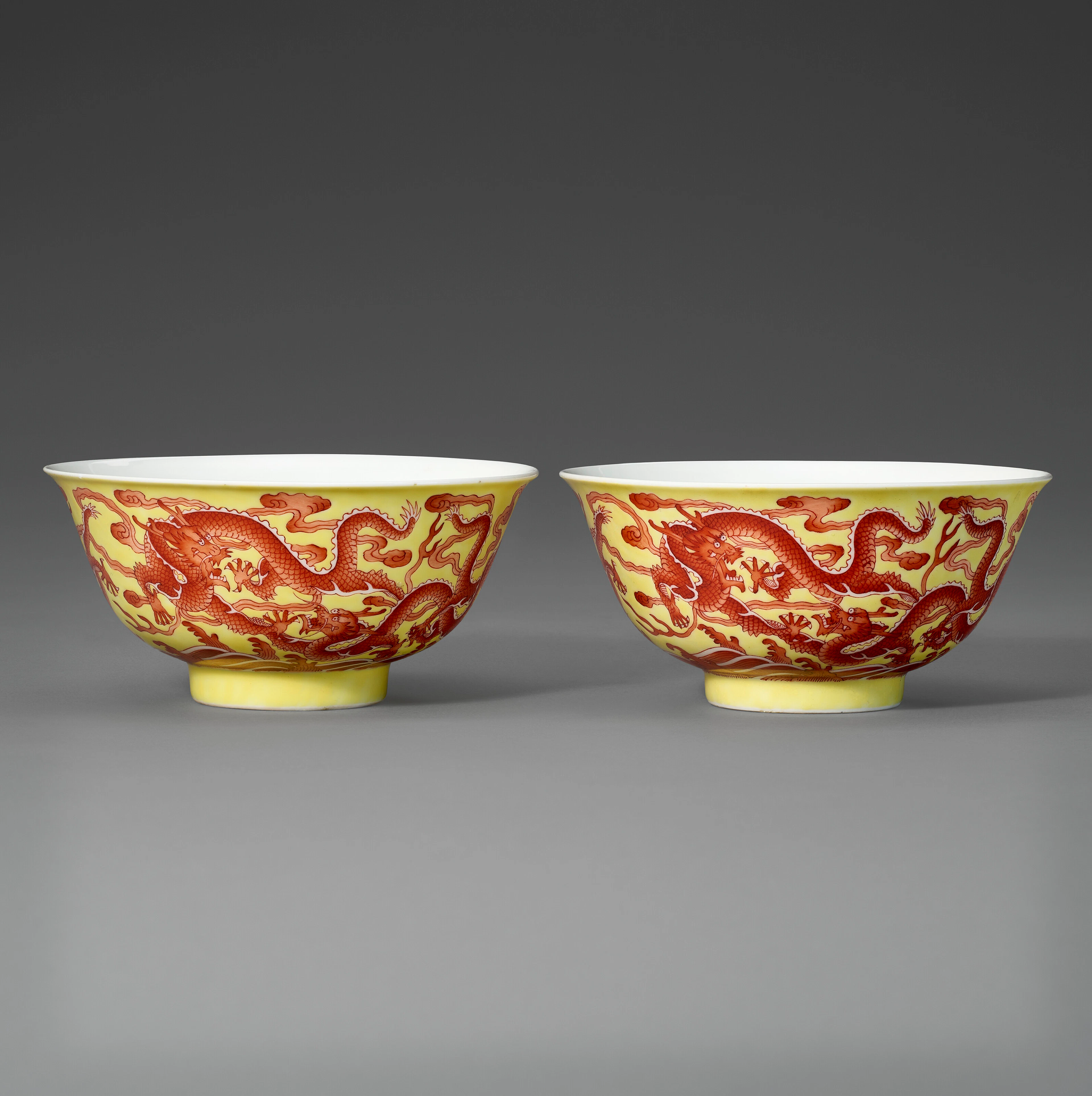 A Rare Pair of Iron-Red-Decorated Yellow-Ground 'Dragon' Bowls
