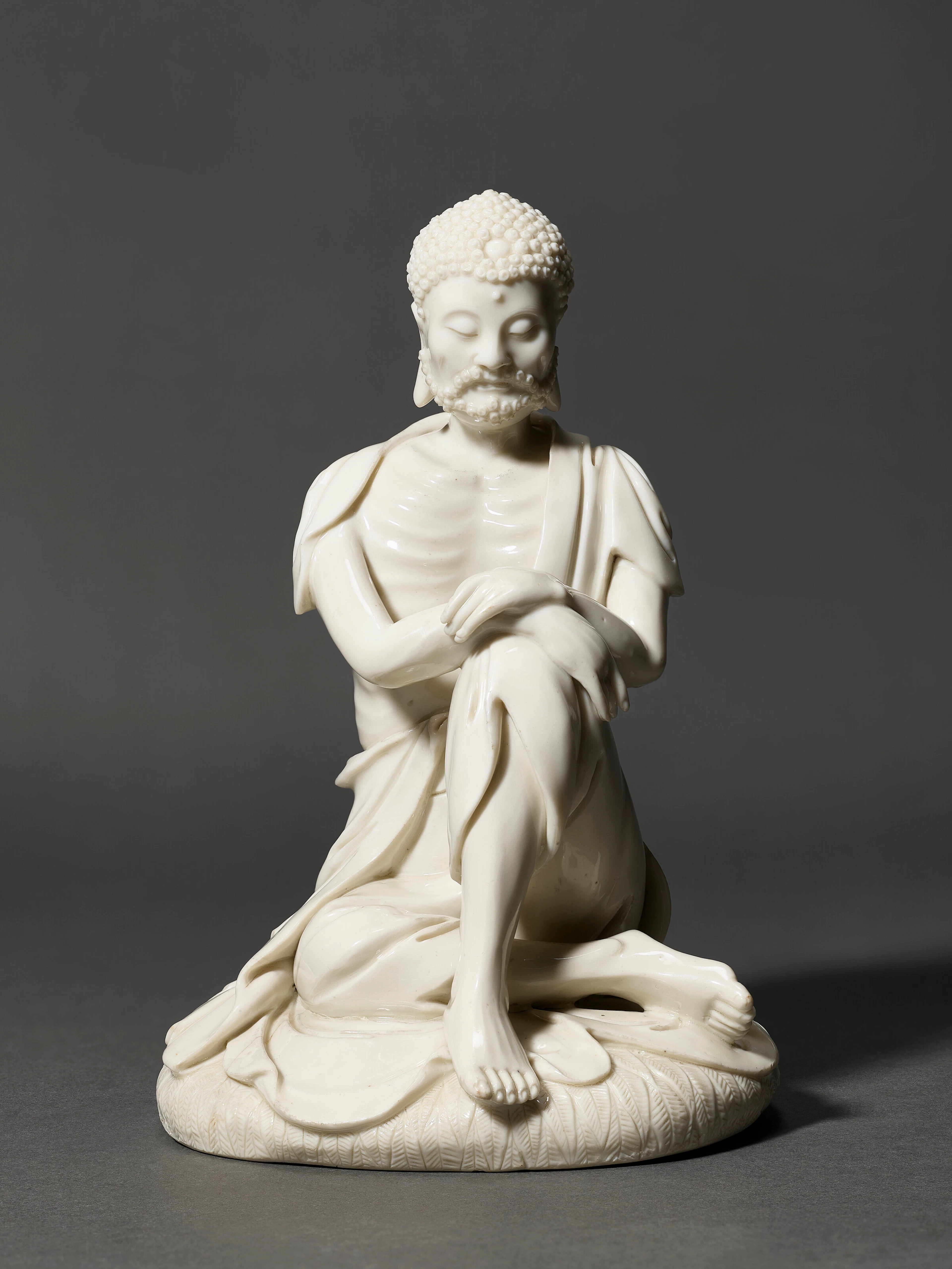 An Exceedingly Rare and Well Modelled Dehua Figure of an Emaciated Buddha
