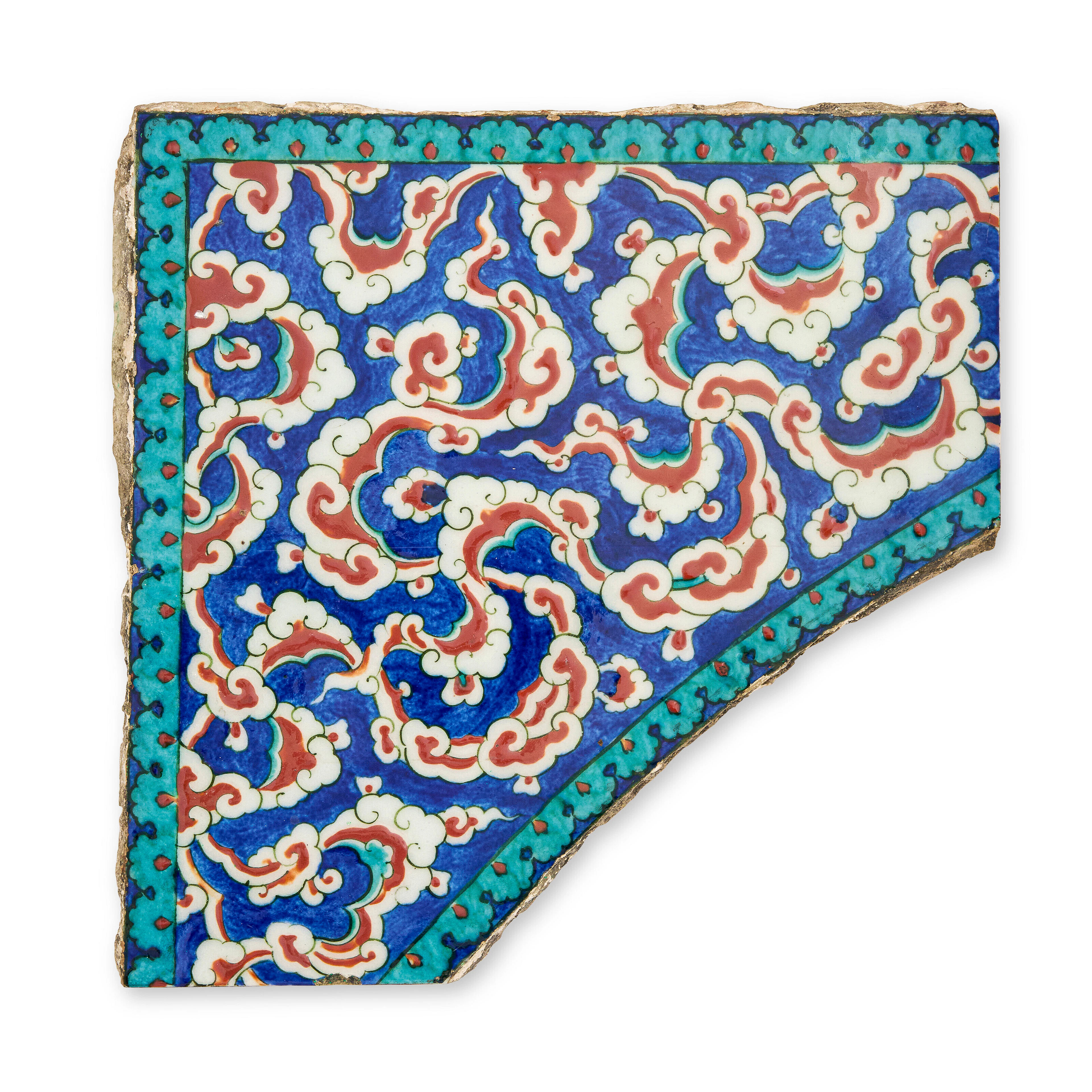 An Iznik Pottery Spandrel Tile