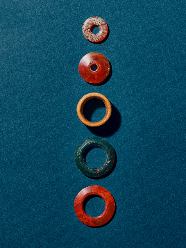 A Group of Three Agate Rings, a Hardstone Ring, and a Bone Ring