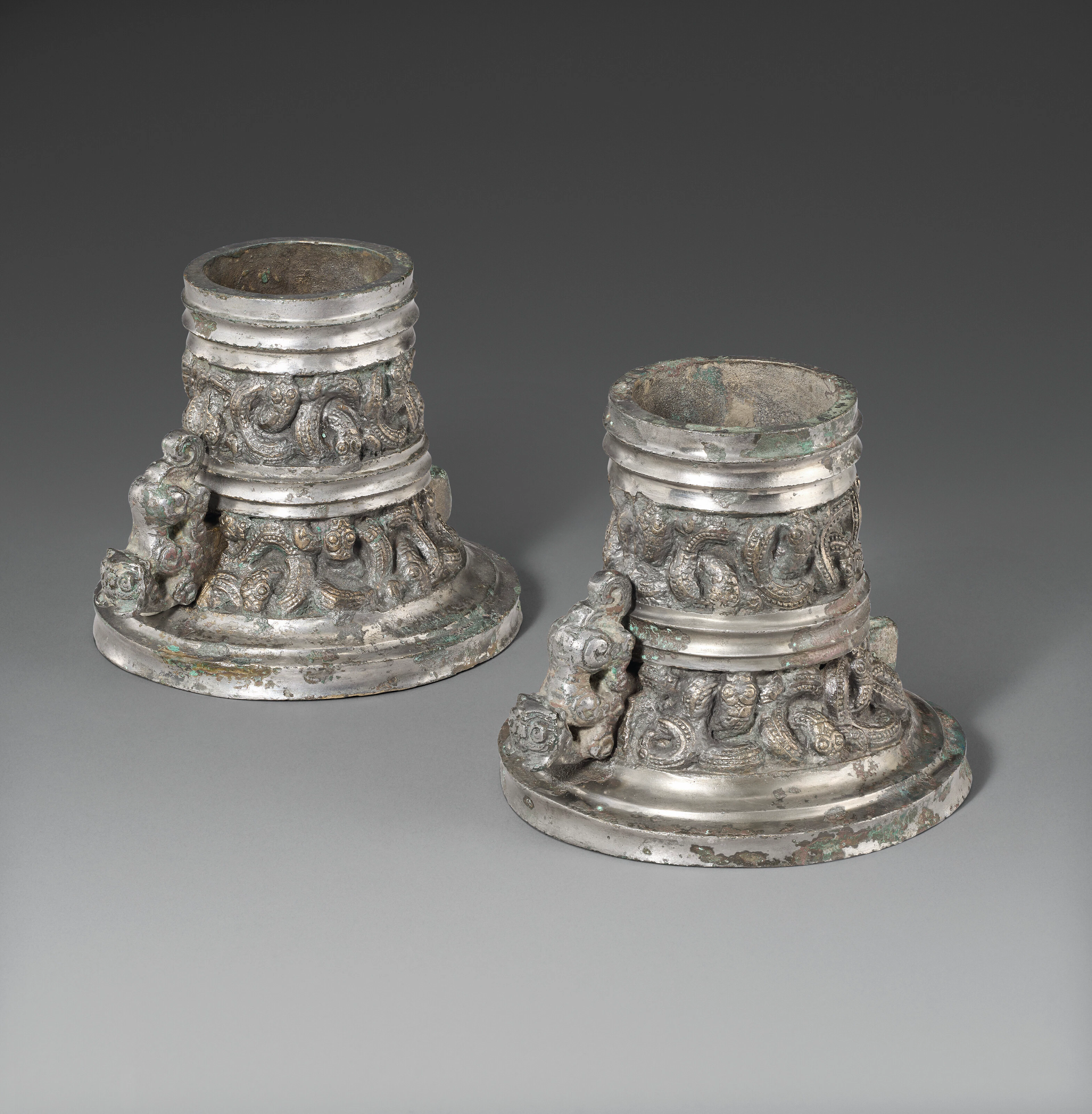A Very Rare Pair of Gilt and Painted Bronze Axle Caps and Lynchpins, Wei Xia