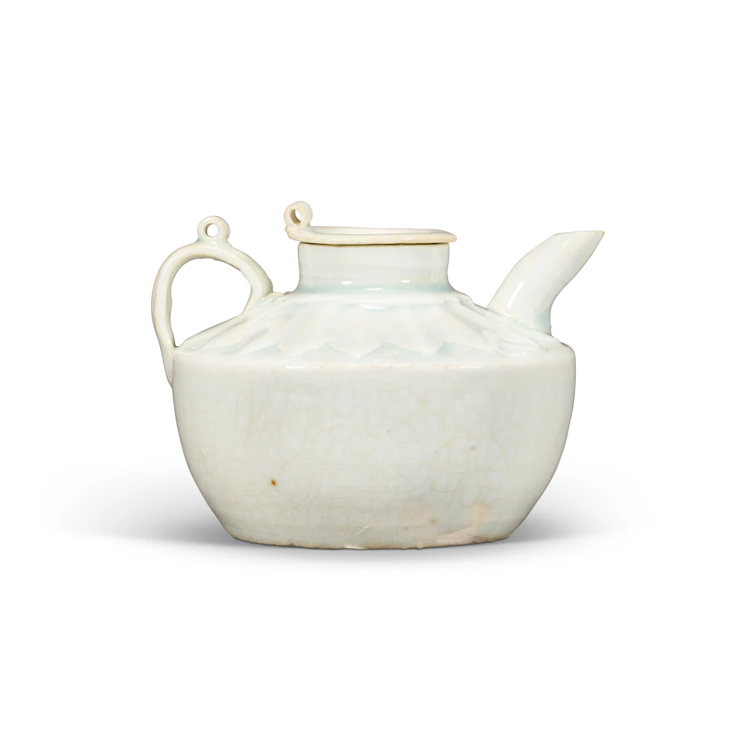 A Small Carved Qingbai 'Lotus' Ewer and Cover
