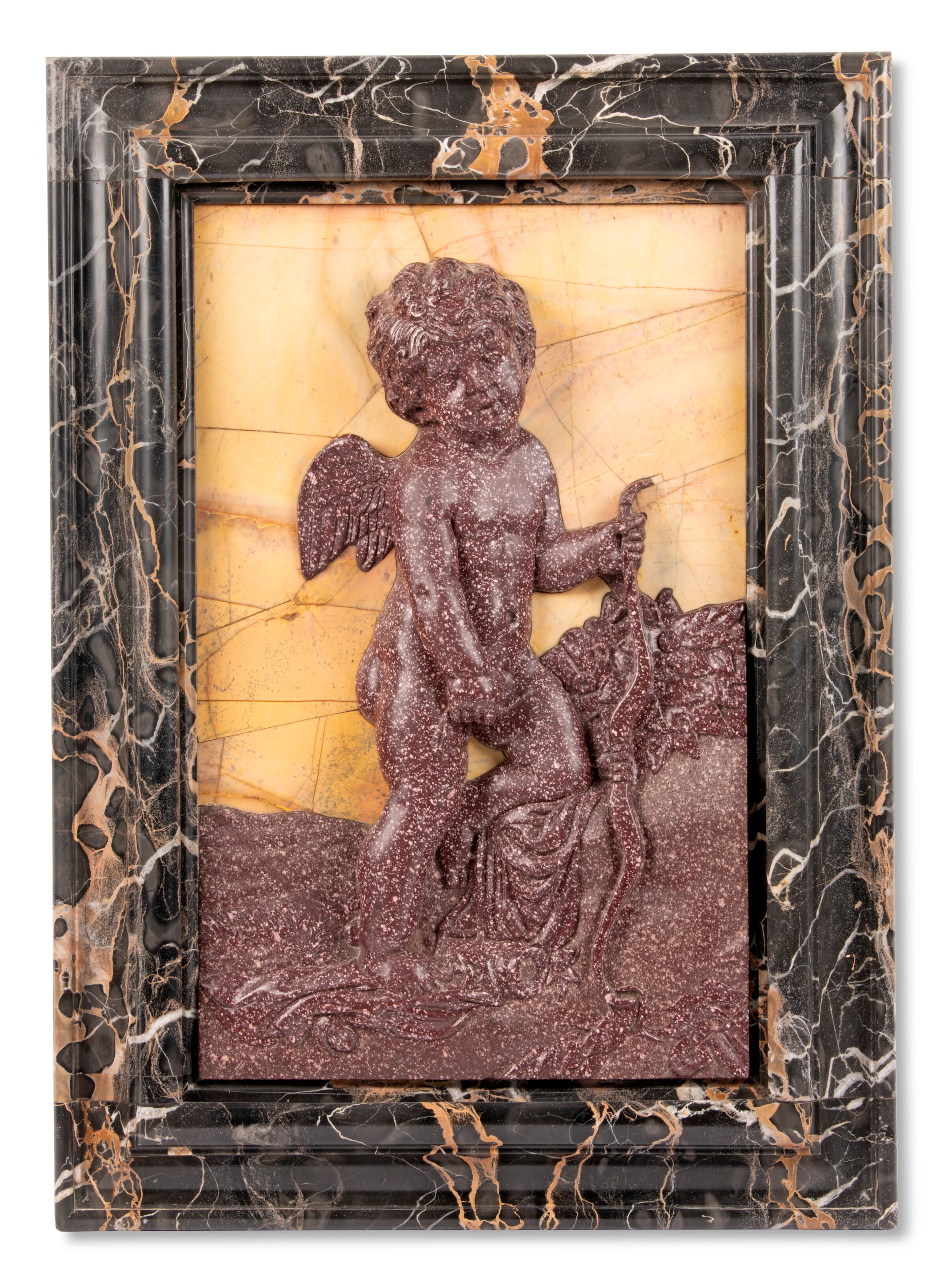 An Italian Porphyry and Giallo Antico Relief of Cupid