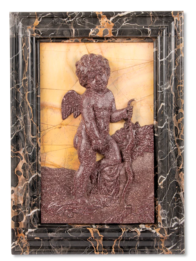 An Italian Porphyry and Giallo Antico Relief of Cupid