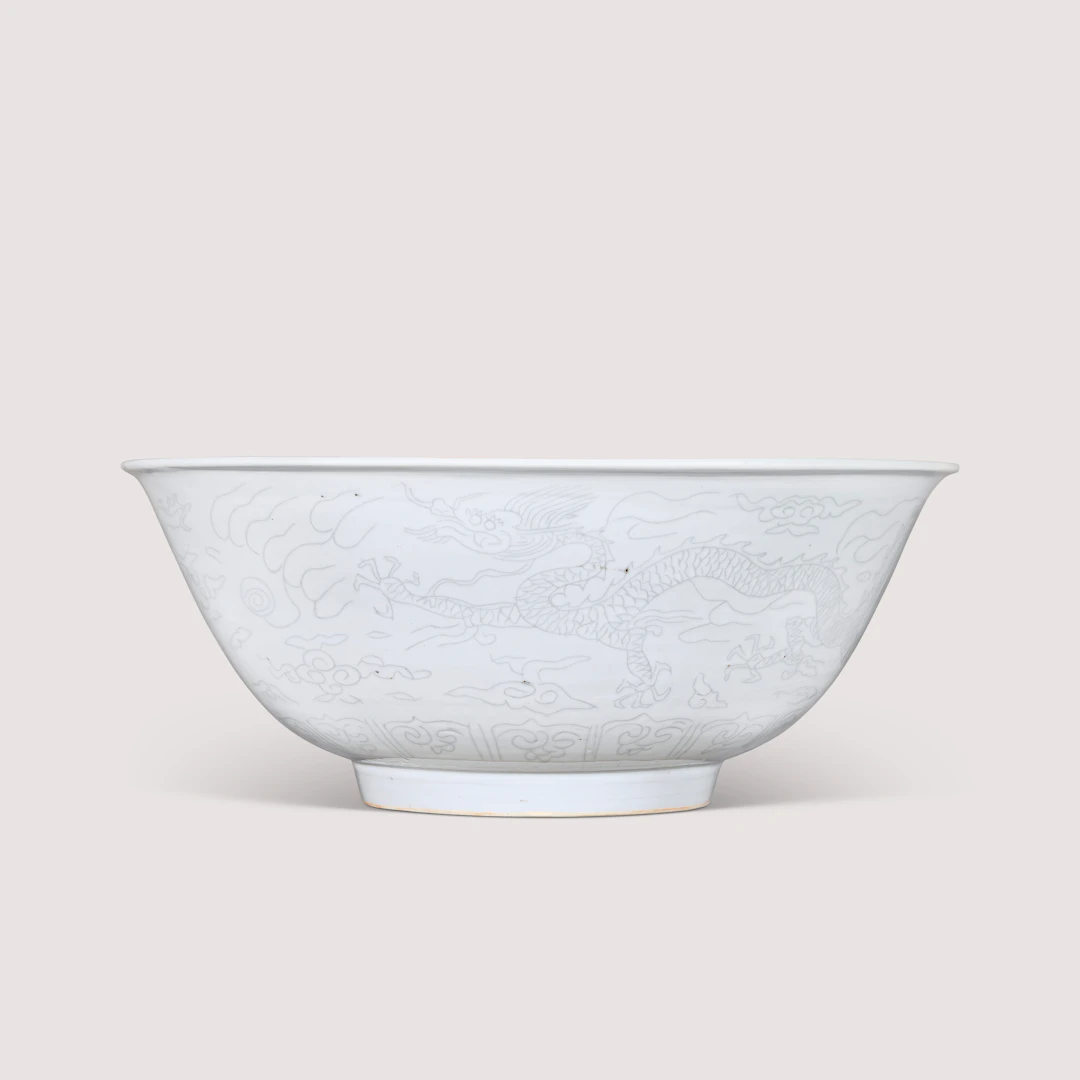 A Rare Large Anhua- Decorated White-Glazed ‘Dragon’ Bowl