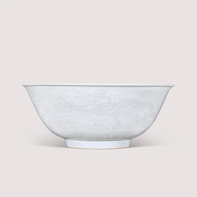 A Rare Large Anhua- Decorated White-Glazed ‘Dragon’ Bowl