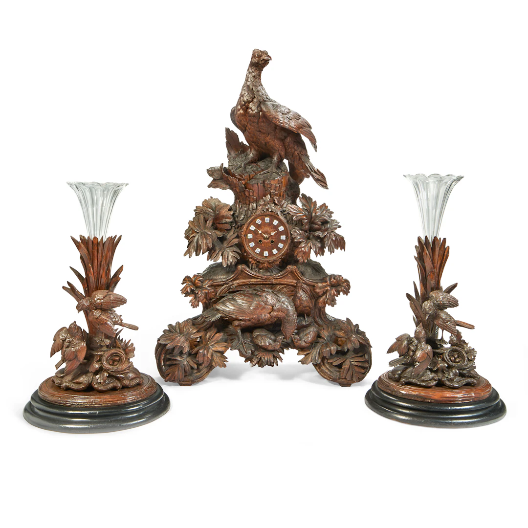 An Assembled Swiss 'Black Forest' Three-Piece Clock Garniture