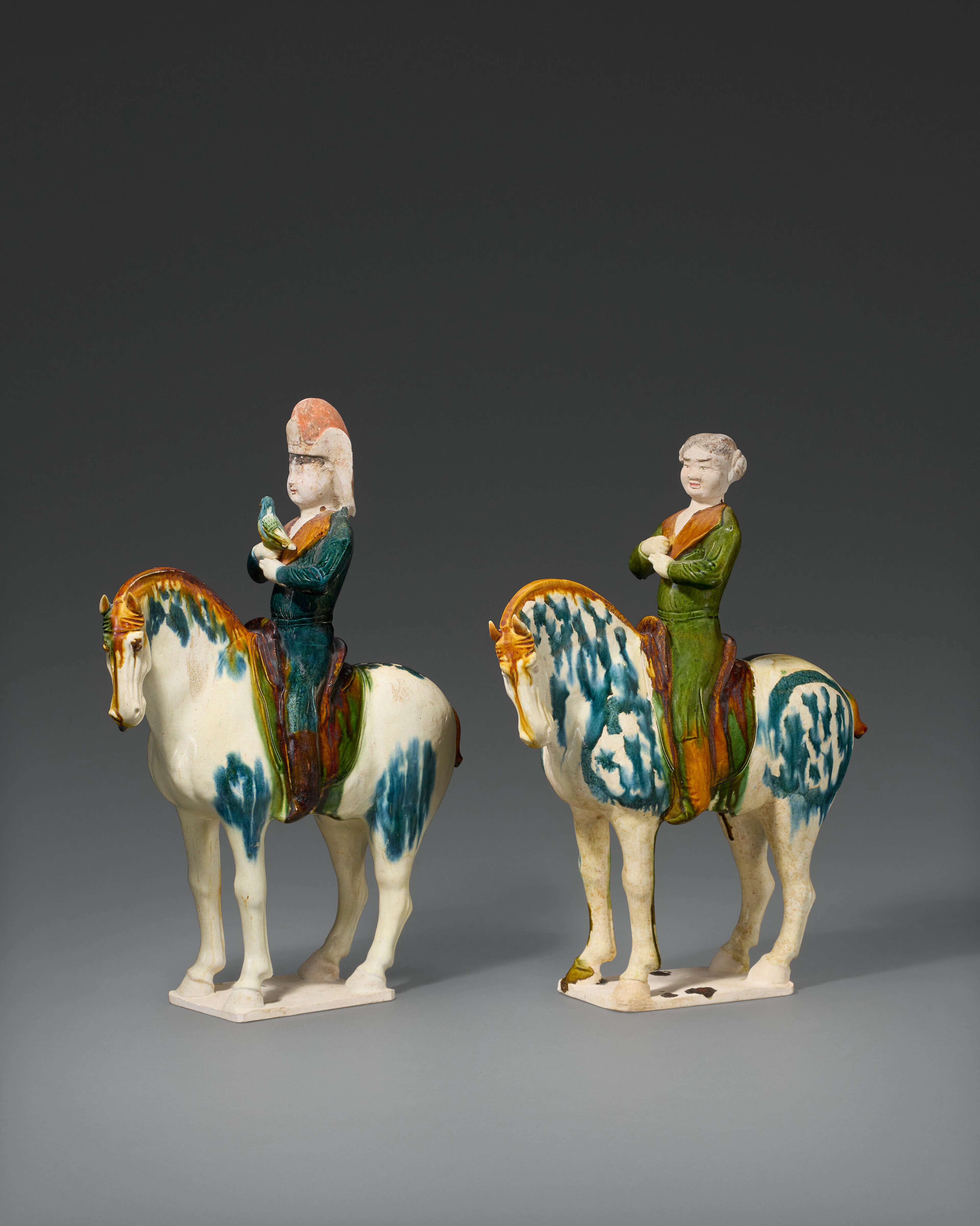 A Pair of Blue and Sancai- Glazed Painted Pottery Figures of Equestrians