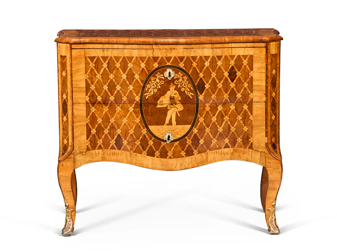 A German Gilt-Metal Mounted Walnut, Fruitwood, Parquetry and Marquetry Commode