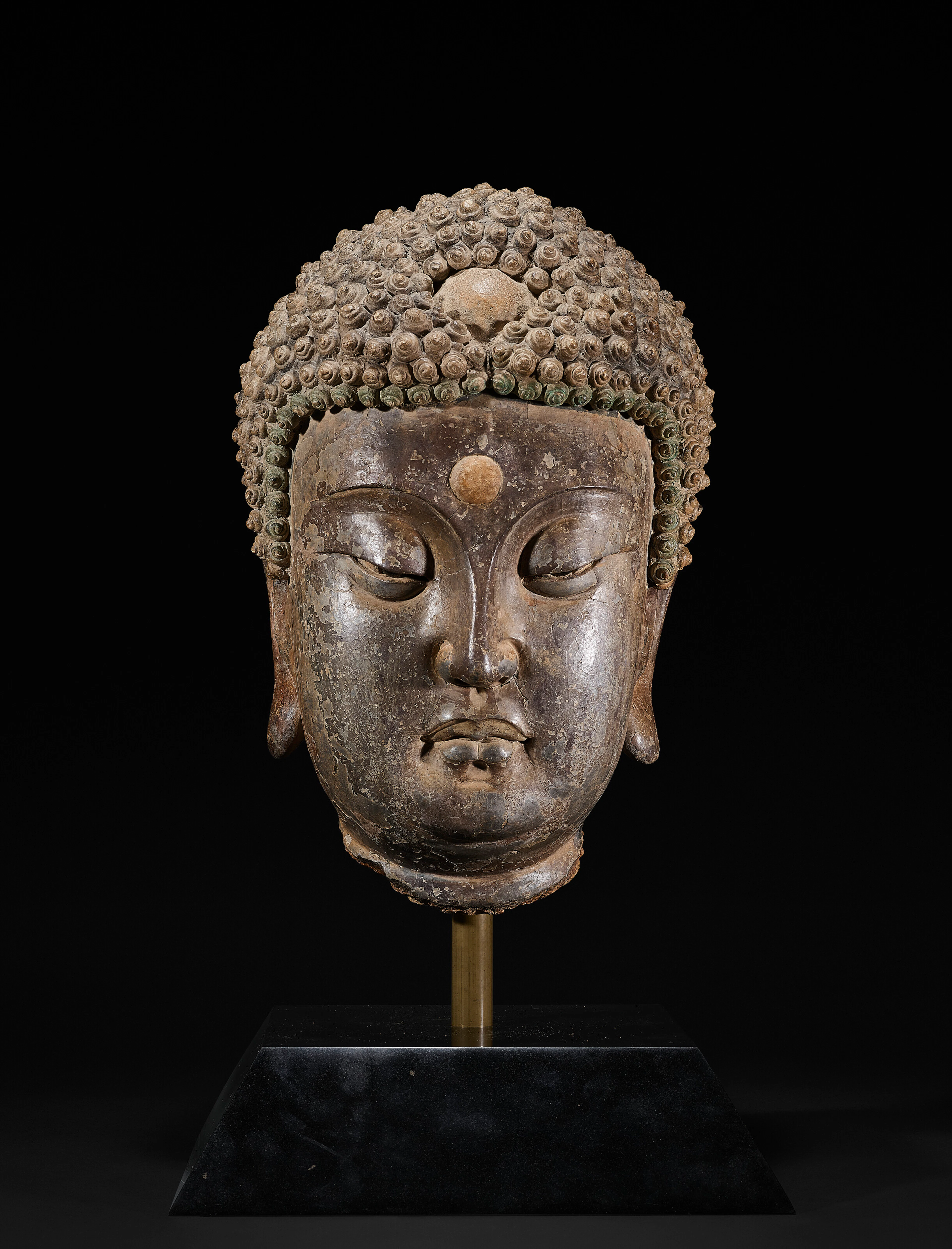 A Very Rare Large Painted Stucco Head of Buddha