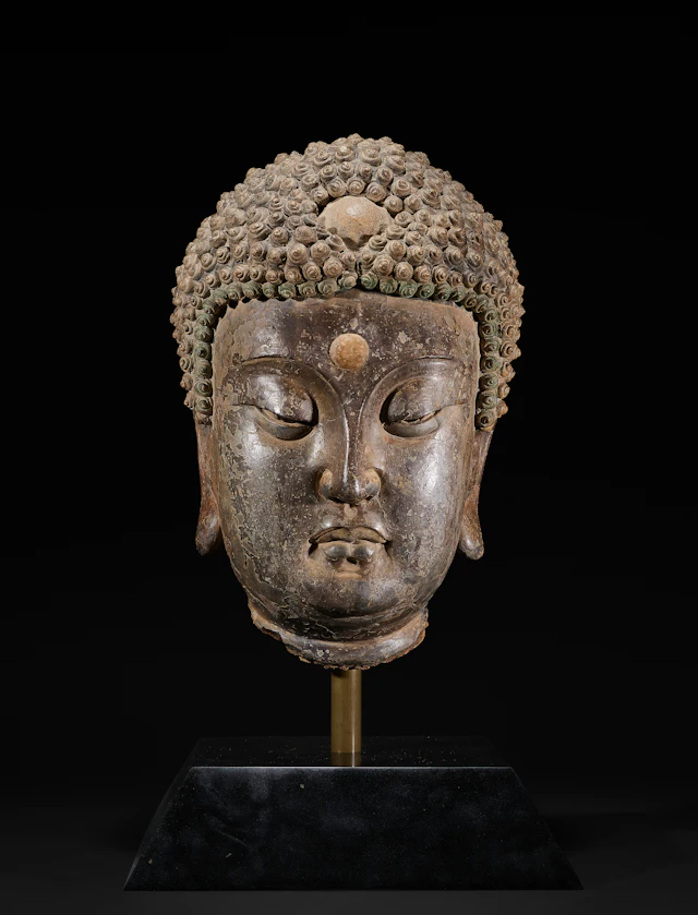 A Very Rare Large Painted Stucco Head of Buddha