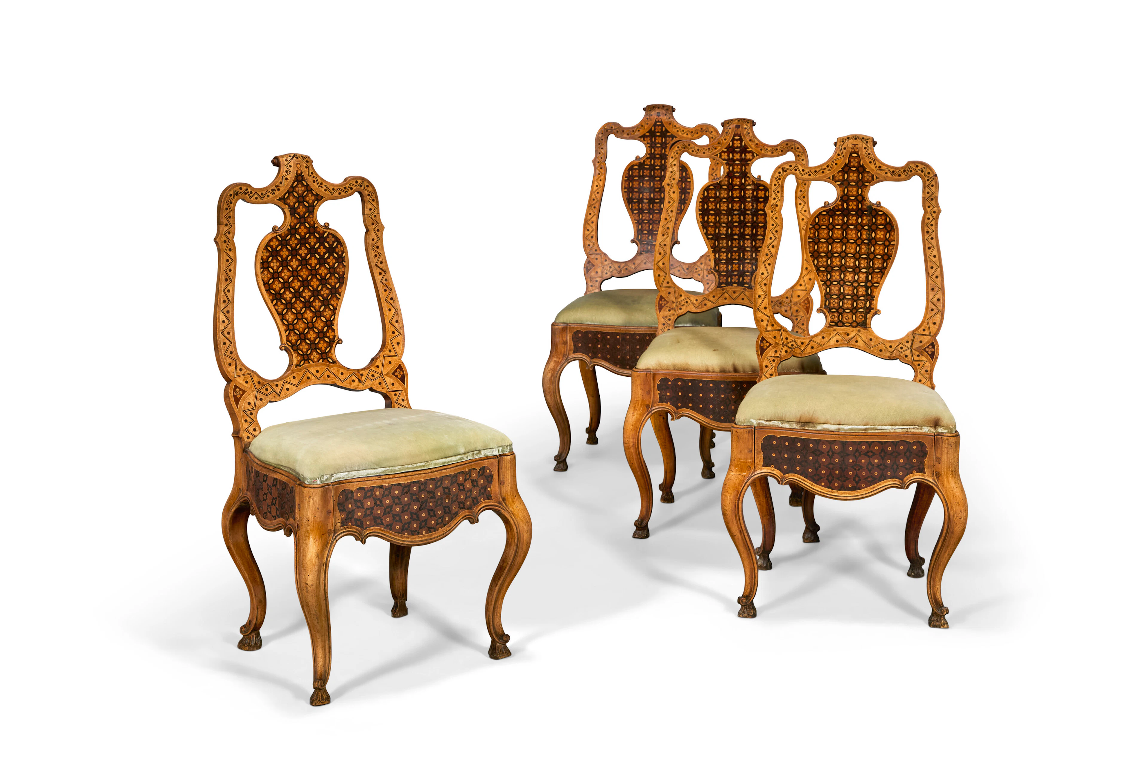 A Set of Four German Walnut, Ebony, Fruitwood and Parquetry Side Chairs