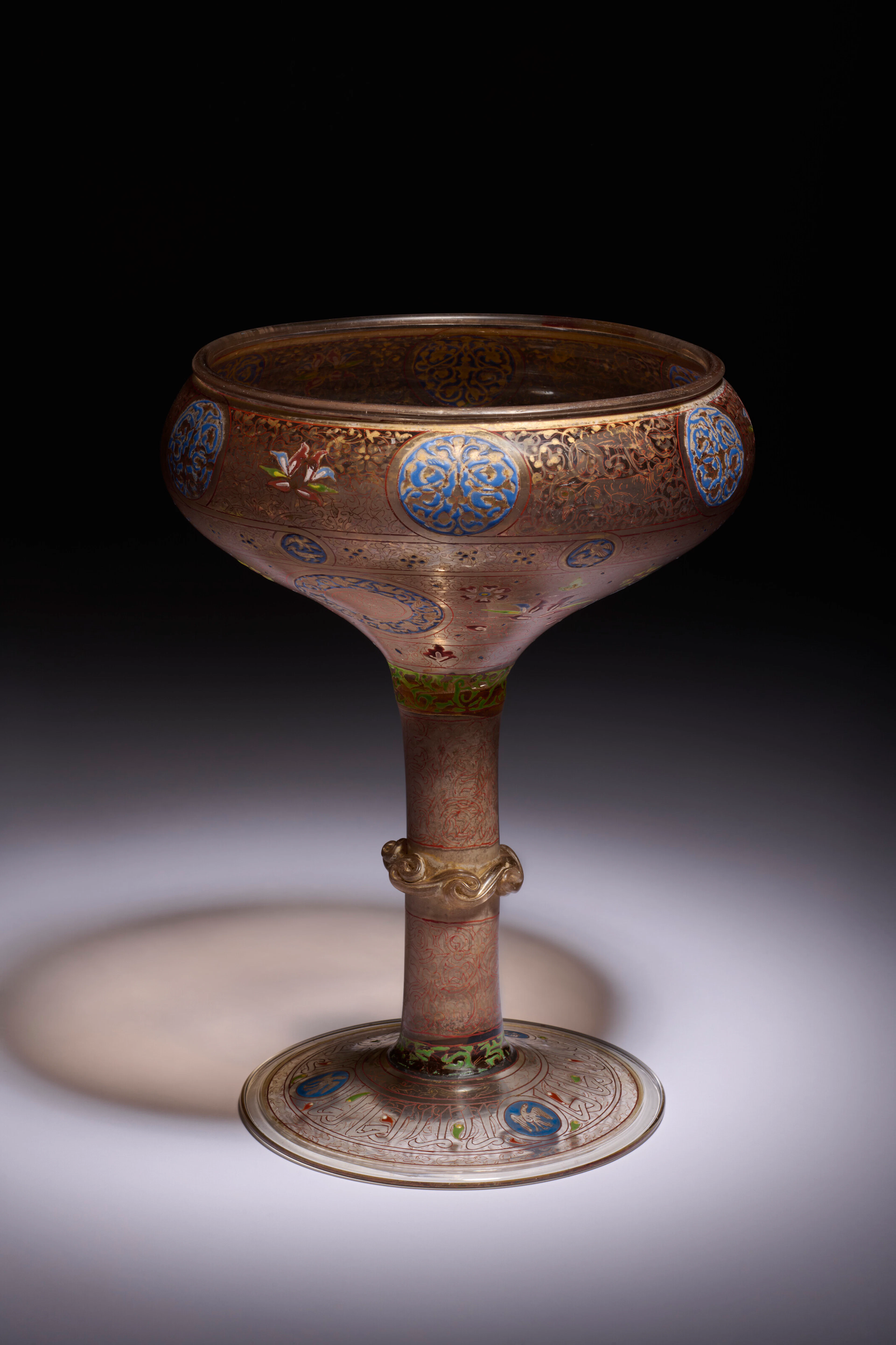 AN IMPORTANT MAMLUK GILDED AND ENAMELLED GLASS FOOTED BOWL