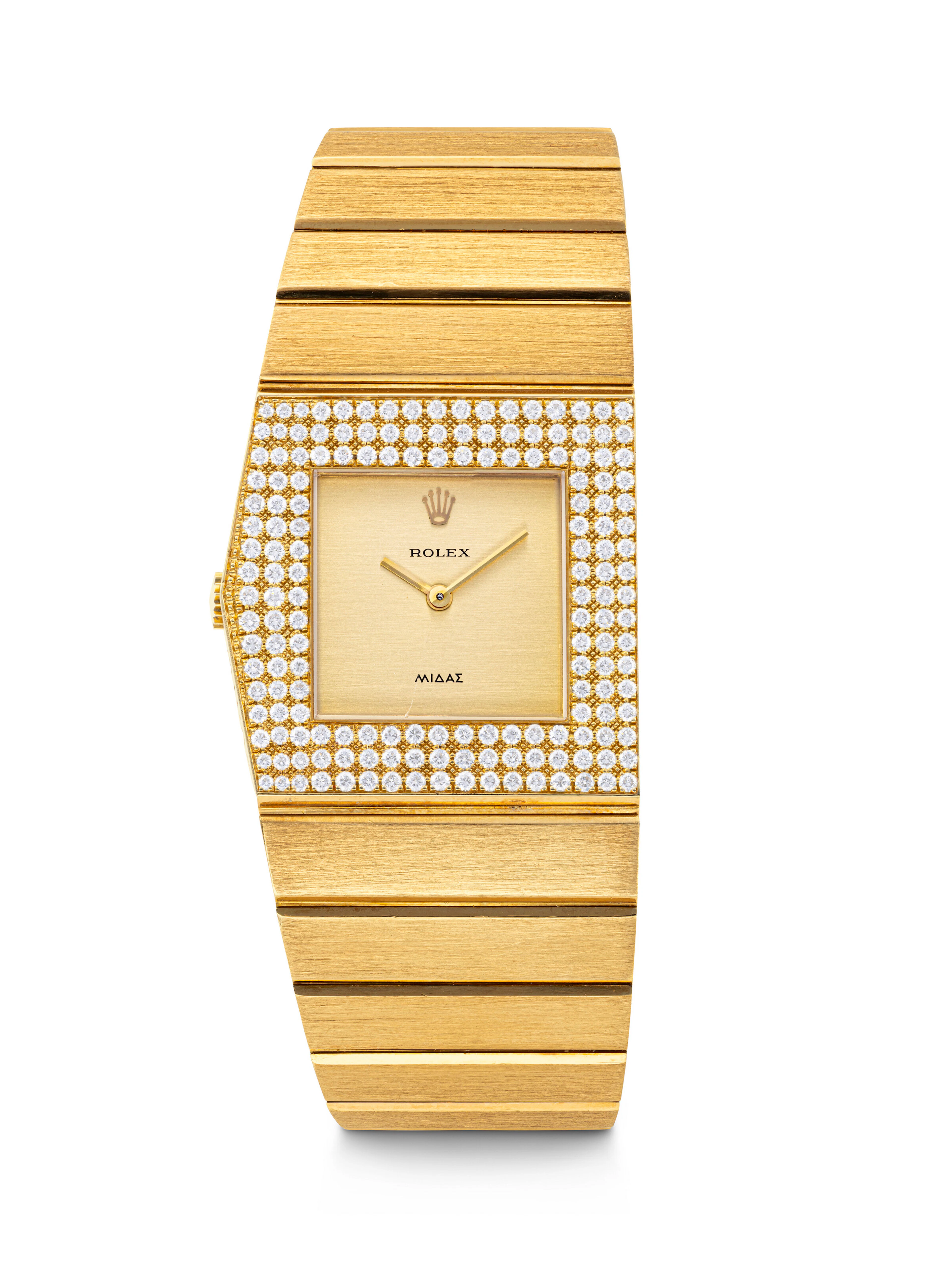 ROLEX. A VERY RARE 18K GOLD AND DIAMOND-SET ASYMMETRICAL LEFT-HANDED