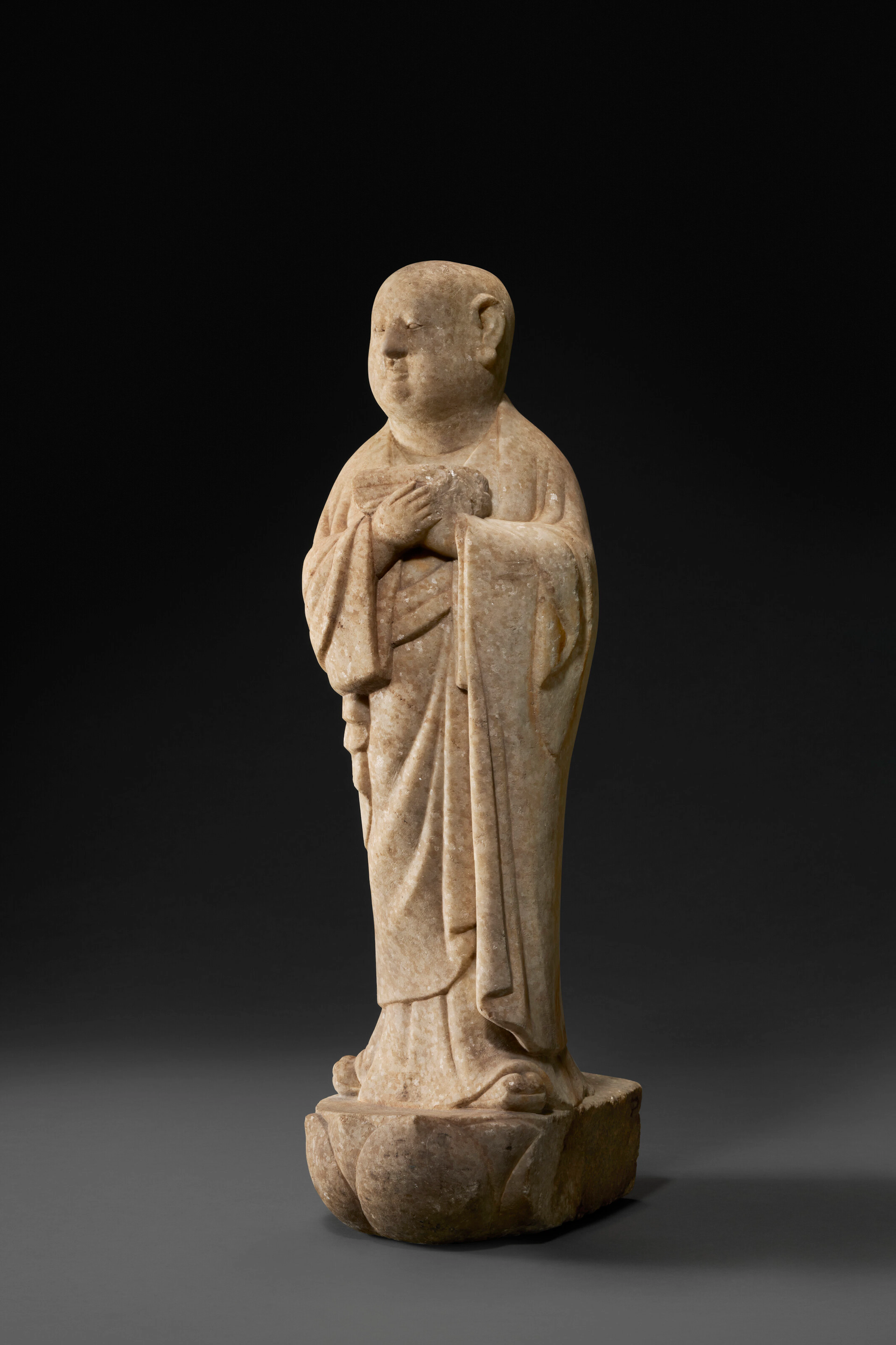 A RARE WHITE MARBLE FIGURE OF A MONK