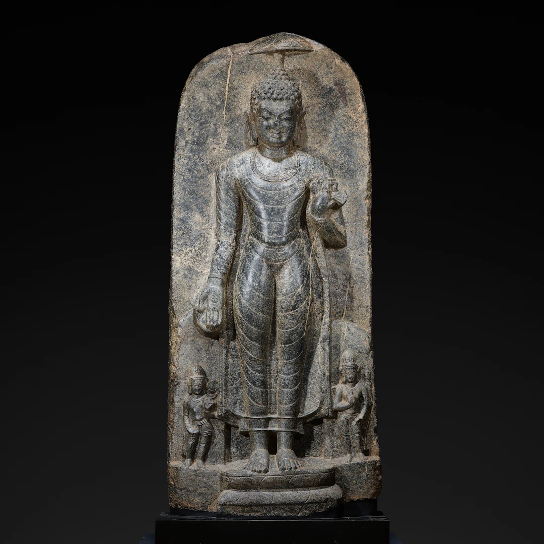 A Black Stone Figure of Standing Buddha