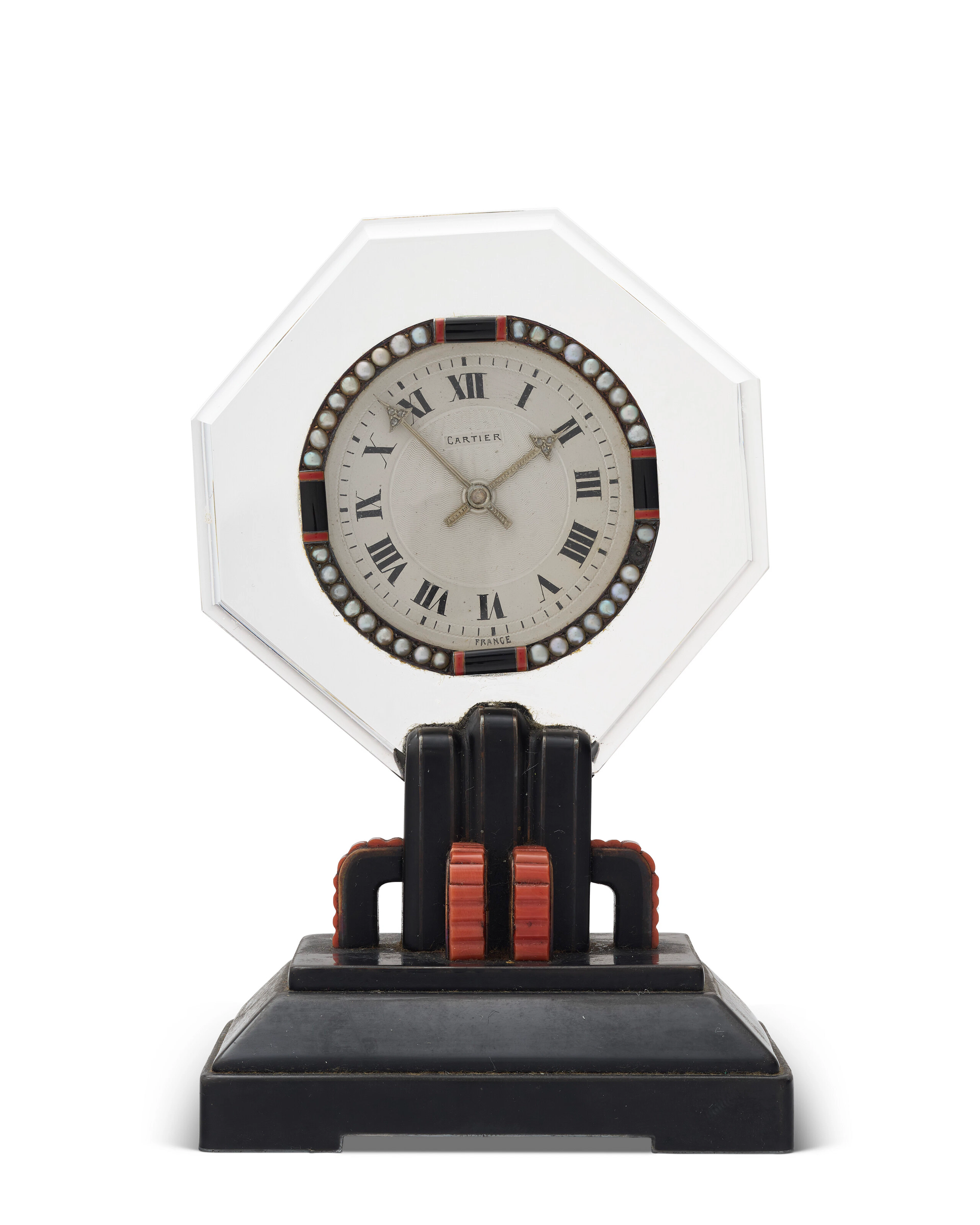 A CARTIER ART DECO CORAL, DIAMOND AND ENAMEL ROCK CRYSTAL TABLE CLOCK
