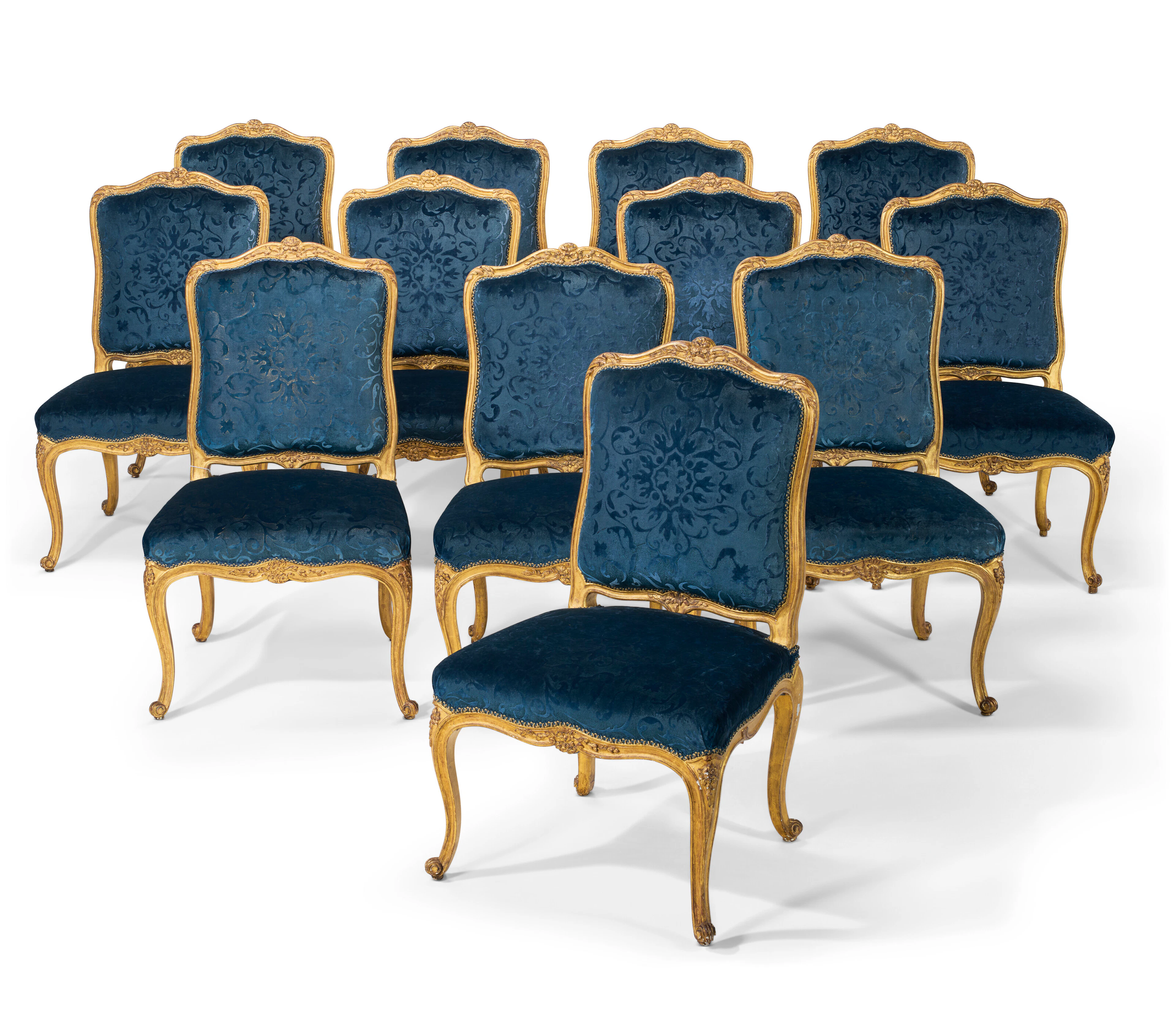 A Set of Twelve French Giltwood Dining Chairs