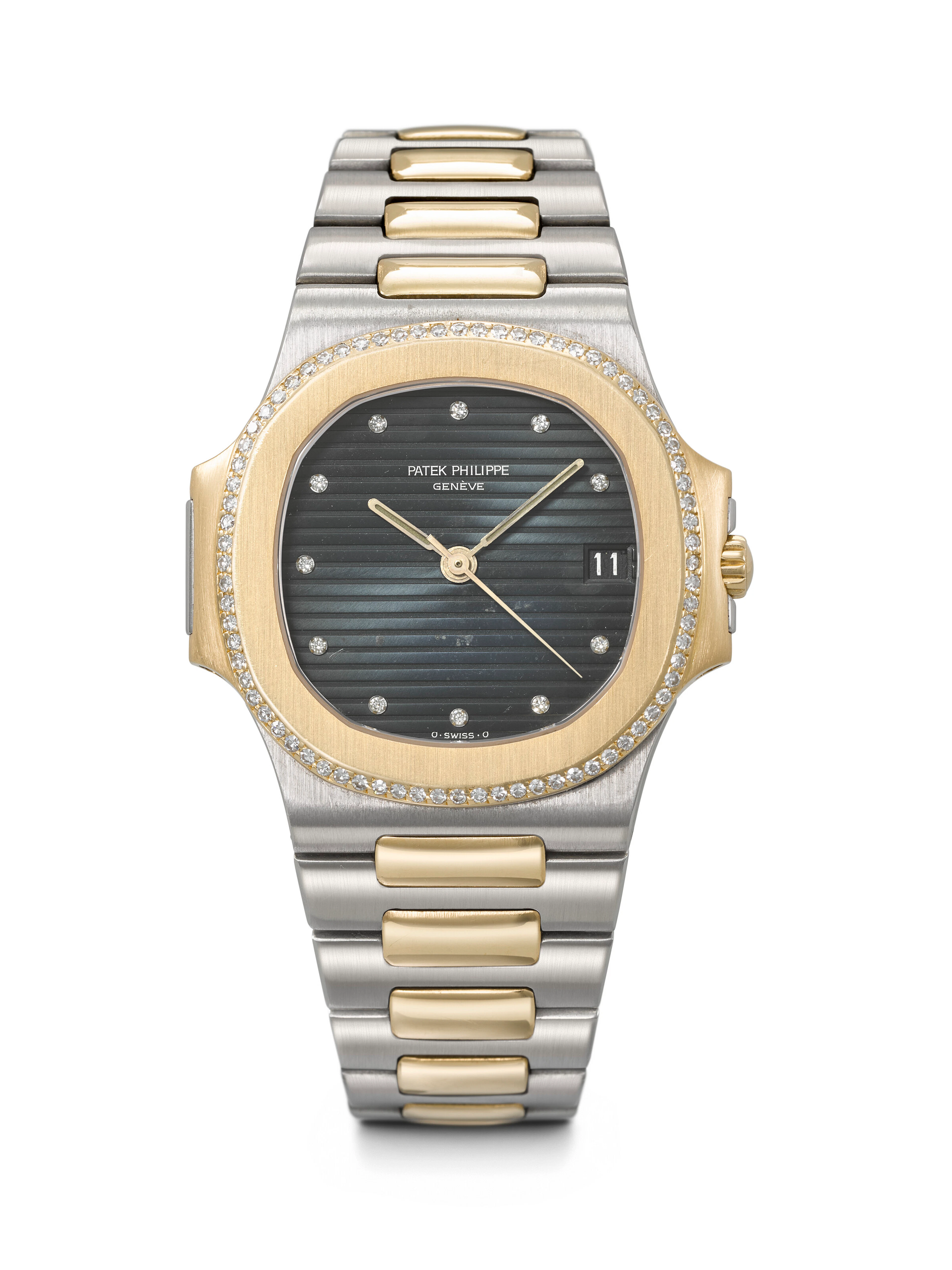Patek Philippe. A Rare and Attractive 18K Gold, Stainless Steel and