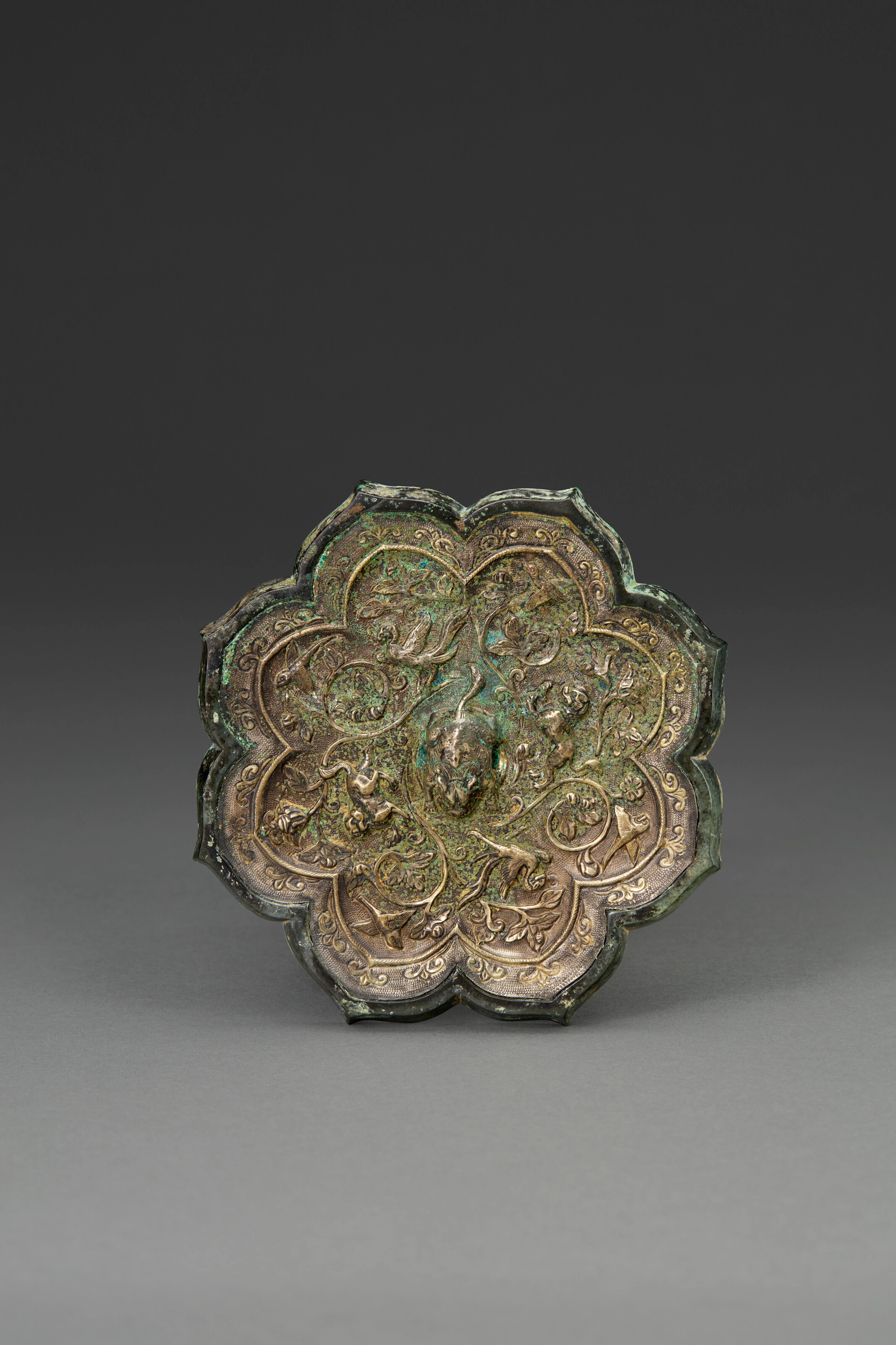A Silver-Backed Parcel-Gilt Bronze 'Animals and Birds' Octofoil Mirror