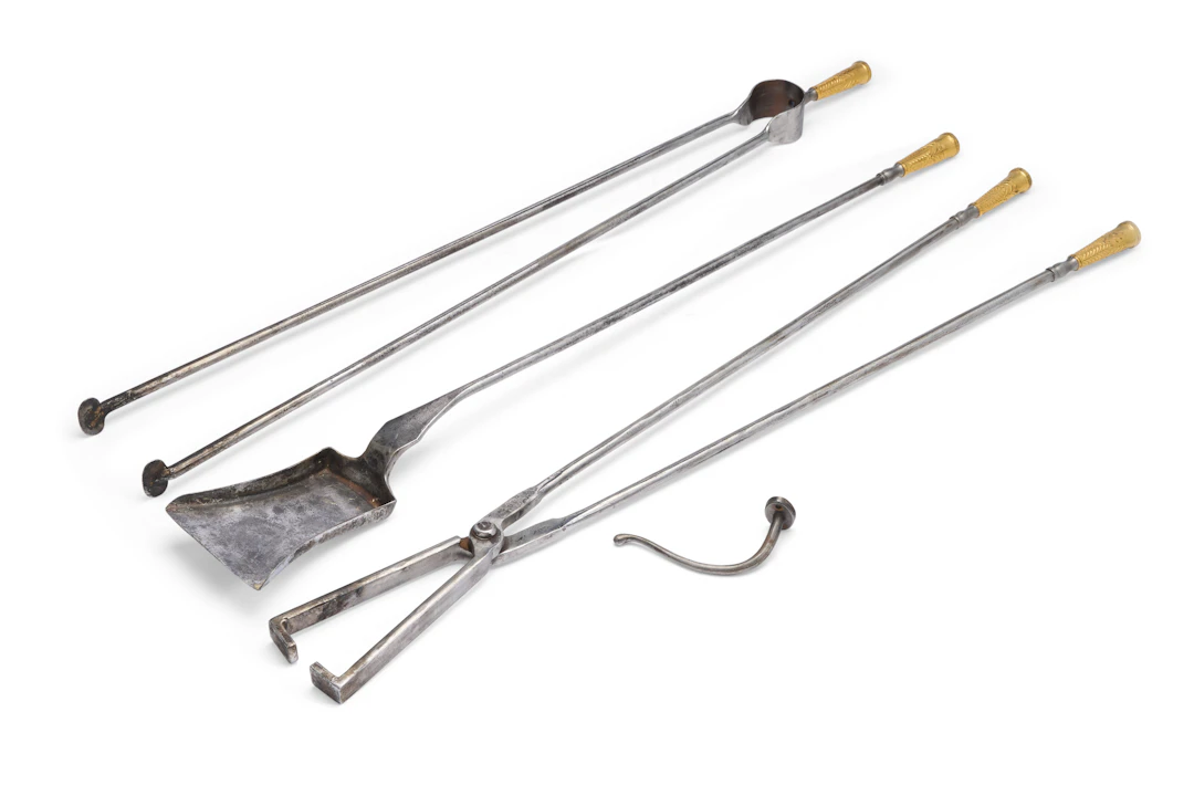 A Set of Three French Ormolu and Steel Firetools