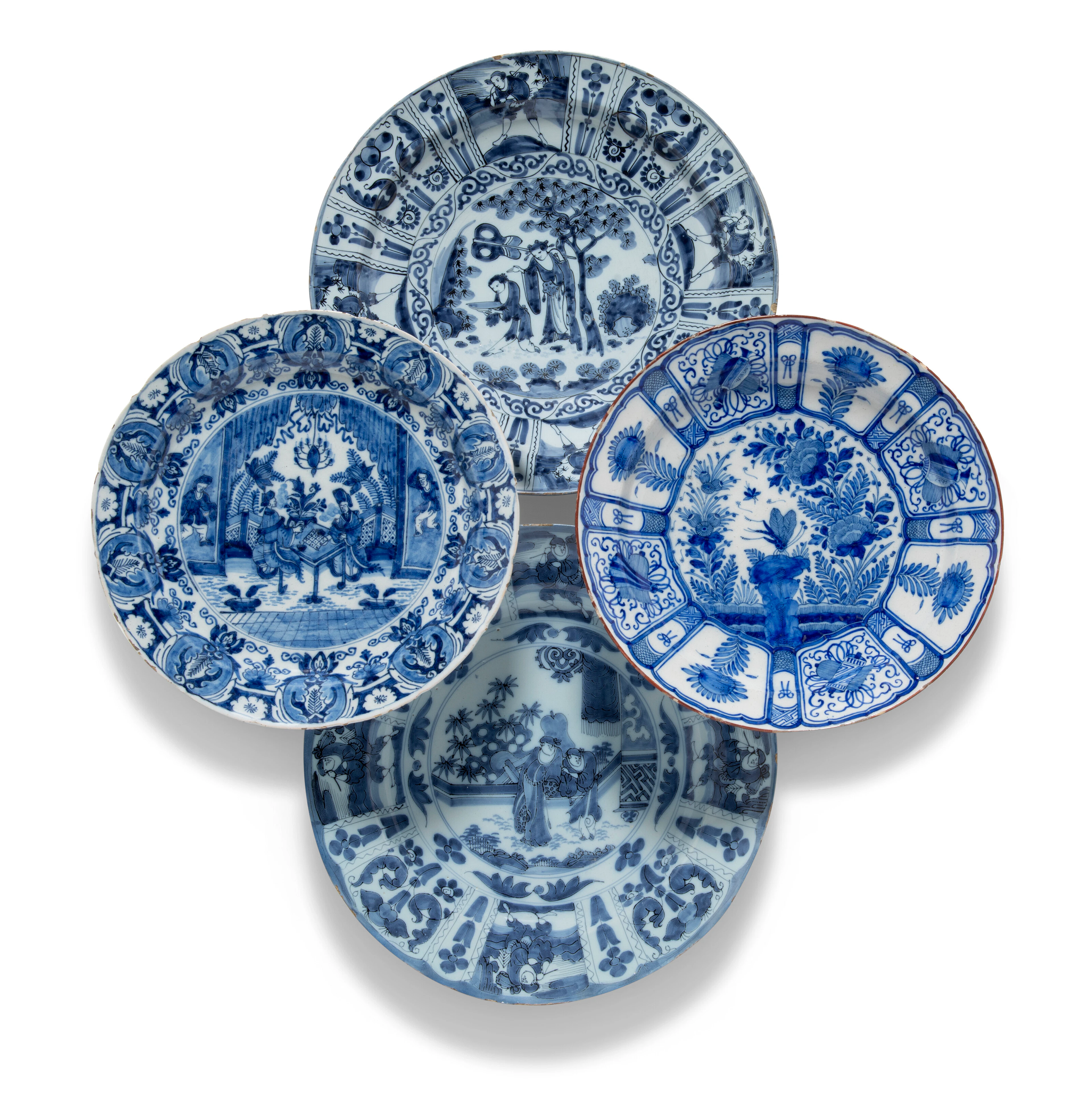 Four Dutch Delft Blue and White Chargers