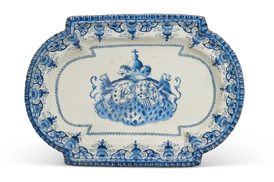 A Dutch Delft Blue and White Armorial Shaped Platter