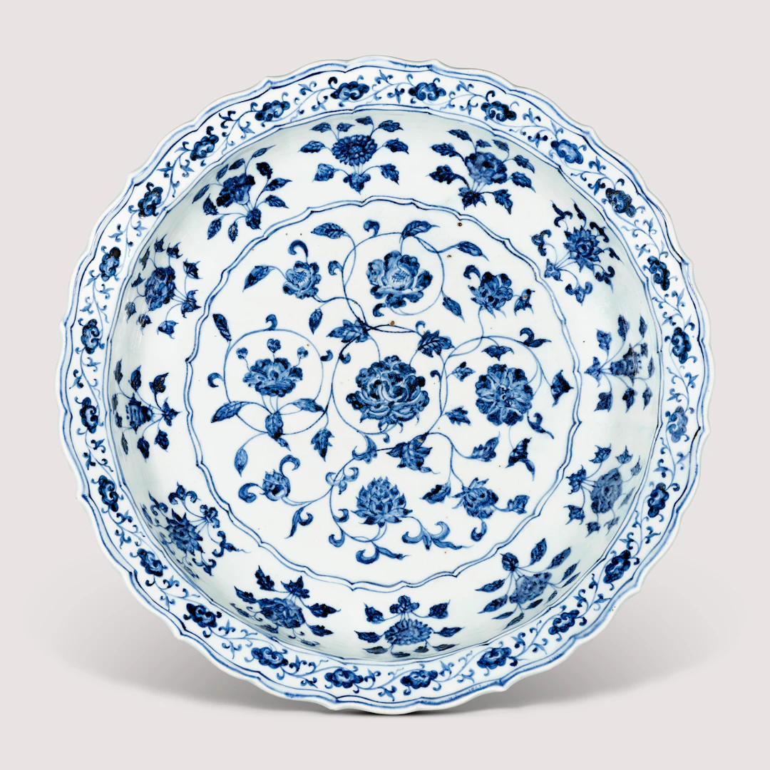 A Fine Large Blue and White ‘Floral Scroll’ Barbed-Rim Dish