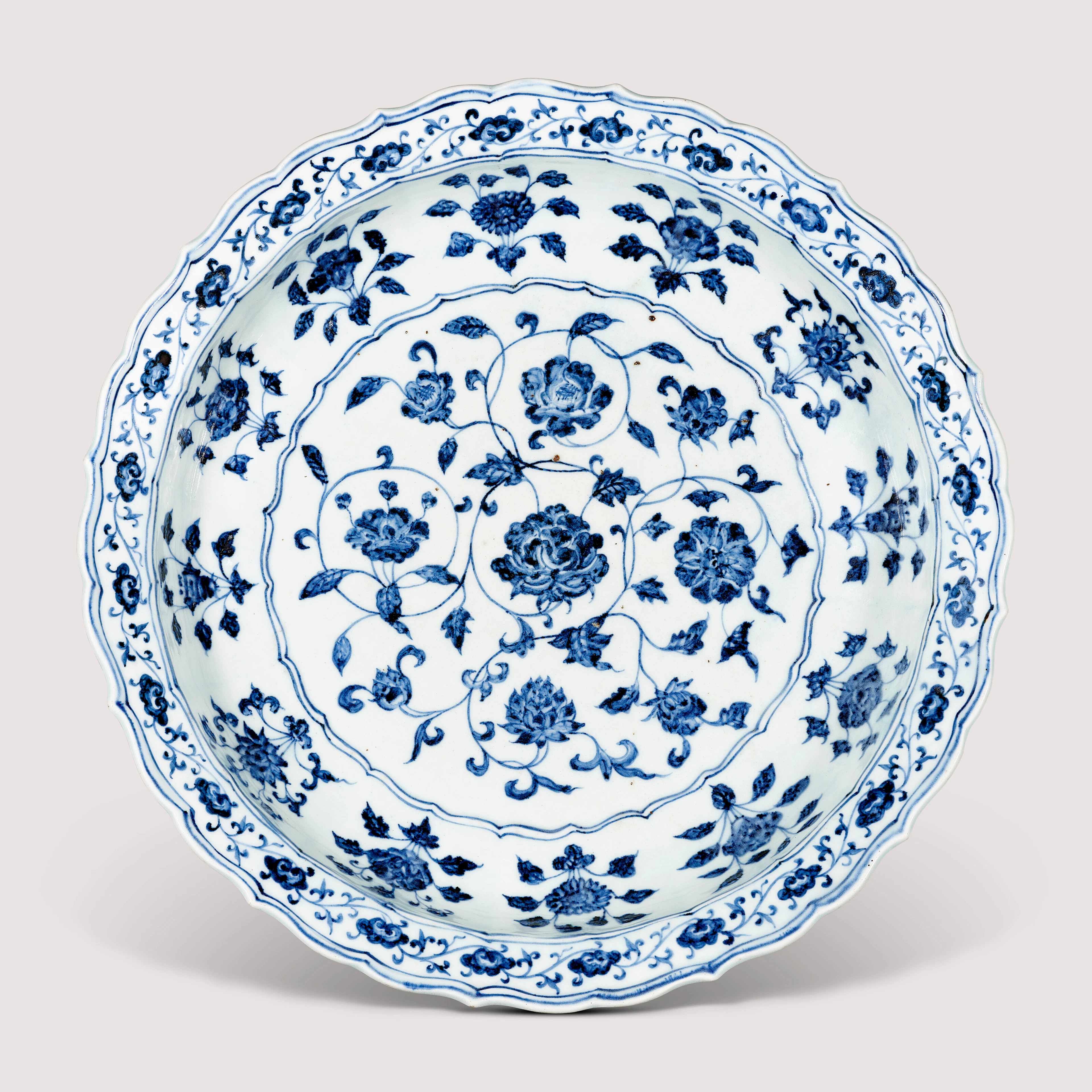 A Fine Large Blue and White ‘Floral Scroll’ Barbed-Rim Dish