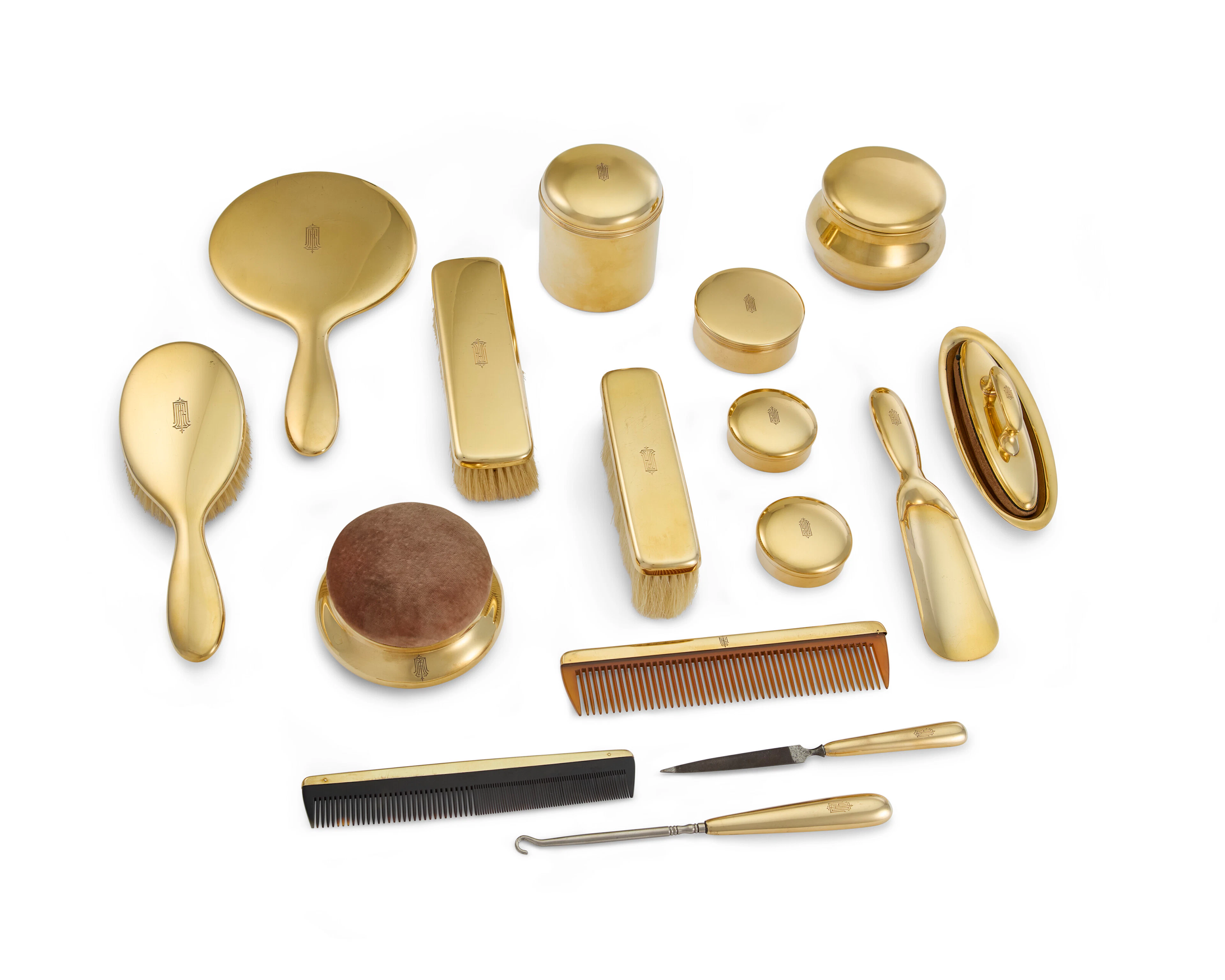 An American Gold Dressing Table Service