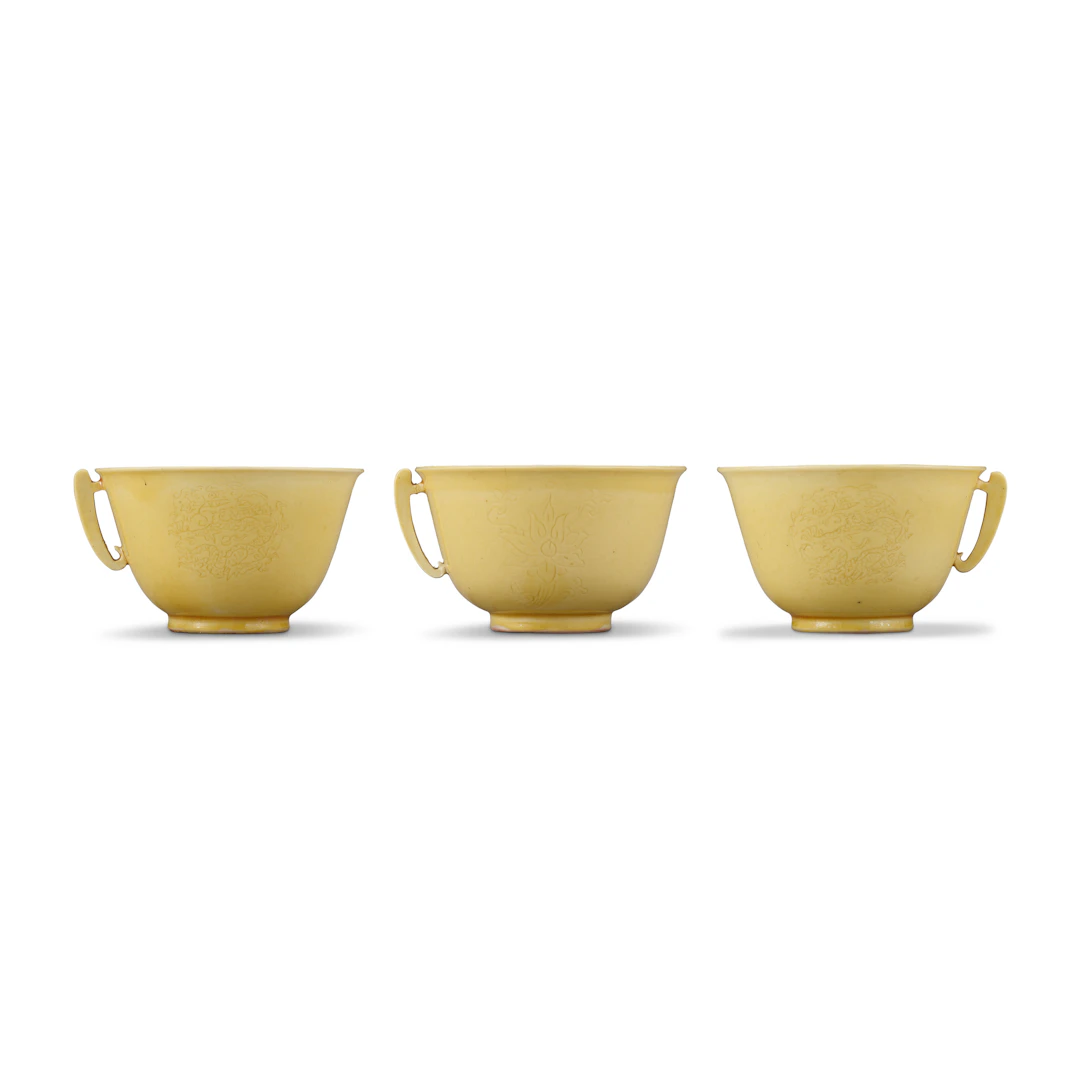 Three Small Incised Yellow-Enamelled Cups