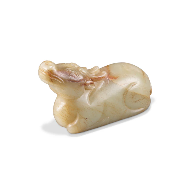 A Celadon Jade Carving of Reclining Deer