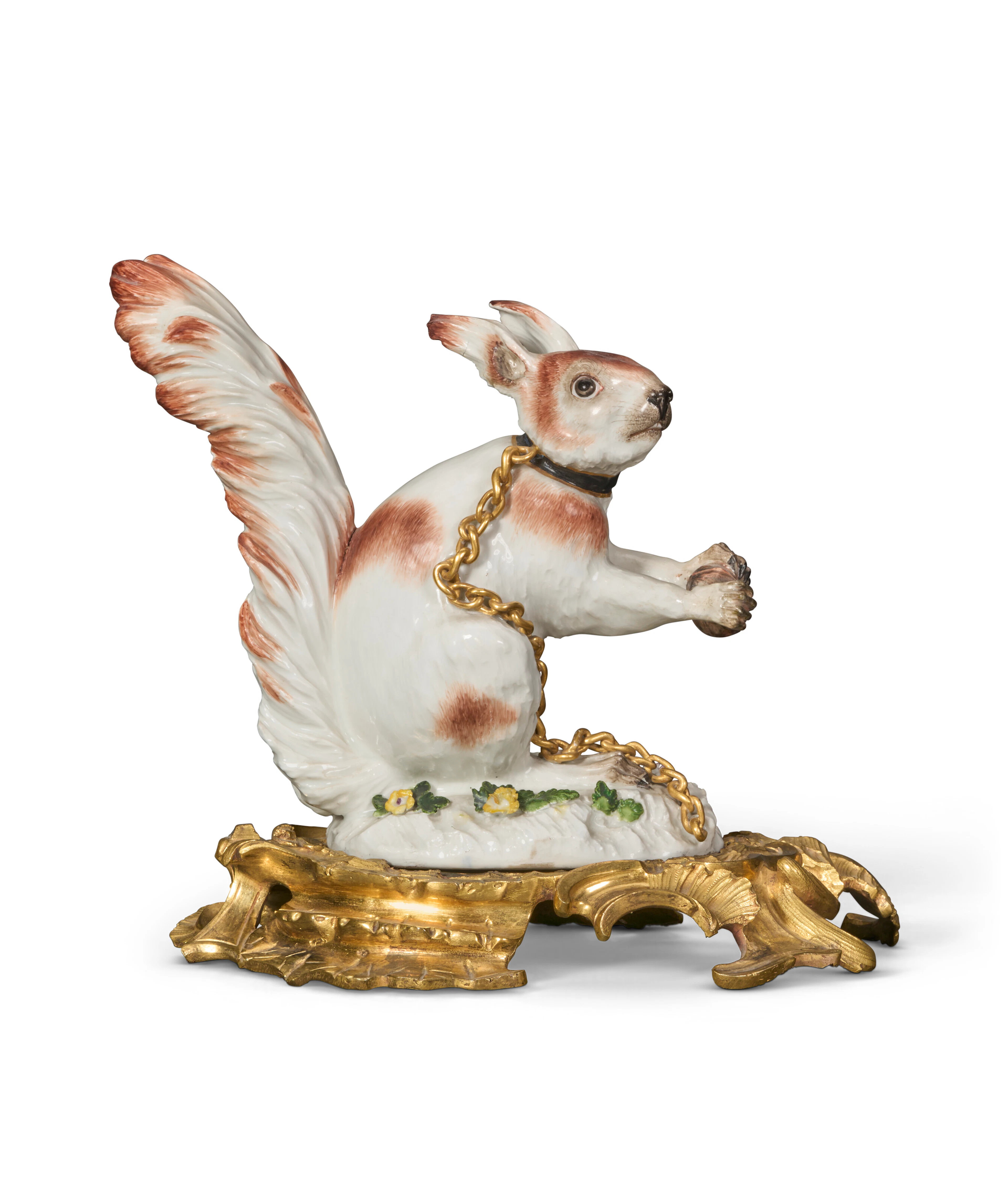 A MEISSEN PORCELAIN SQUIRREL AND A LOUIS XV ORMOLU BASE