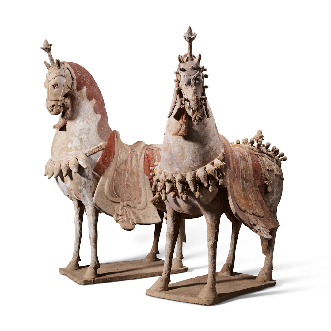 An Exceptional Pair of Painted Pottery Figures of Caparisoned Horses