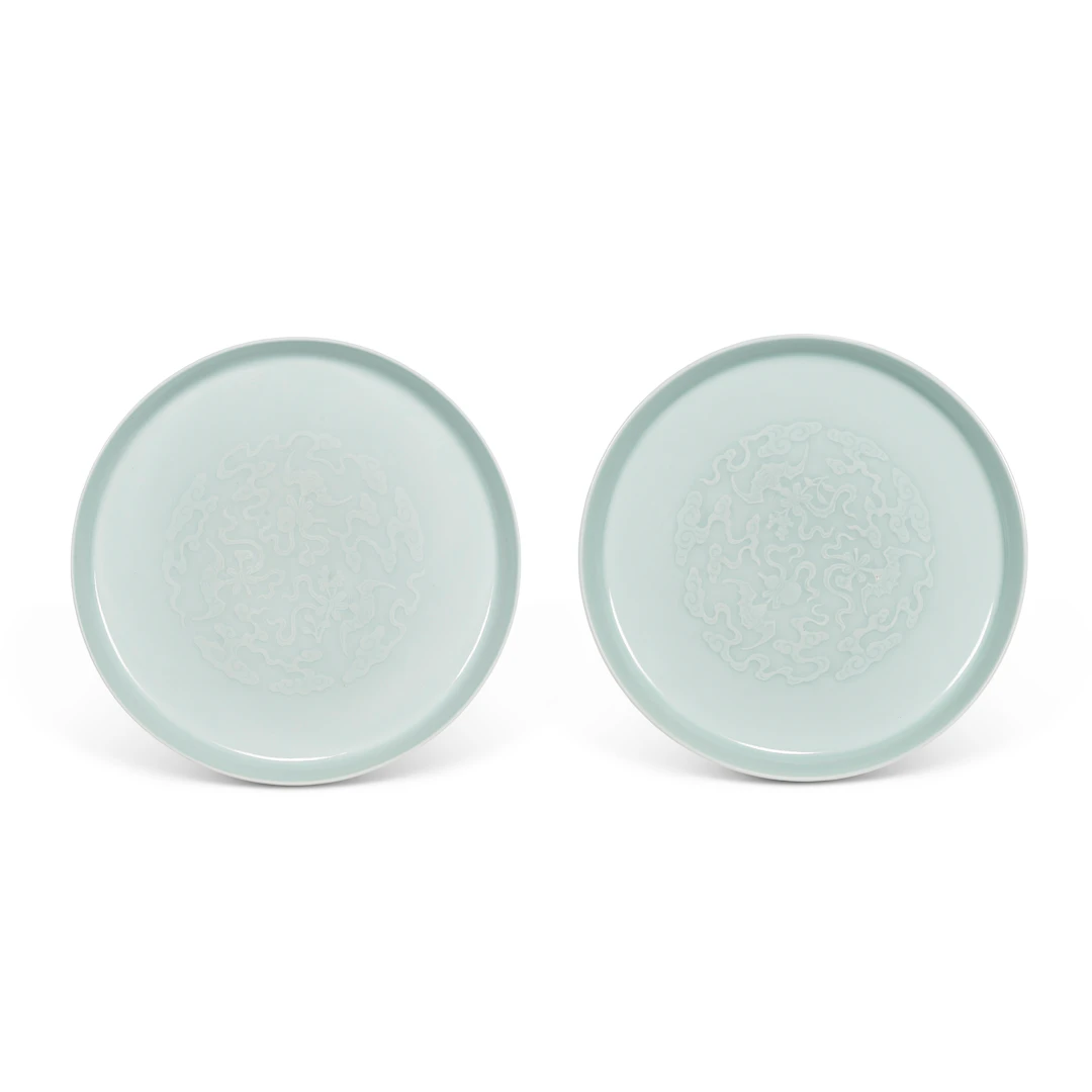 A Pair of Incised Celadon-Glazed ‘Bats and Clouds’ Dishes