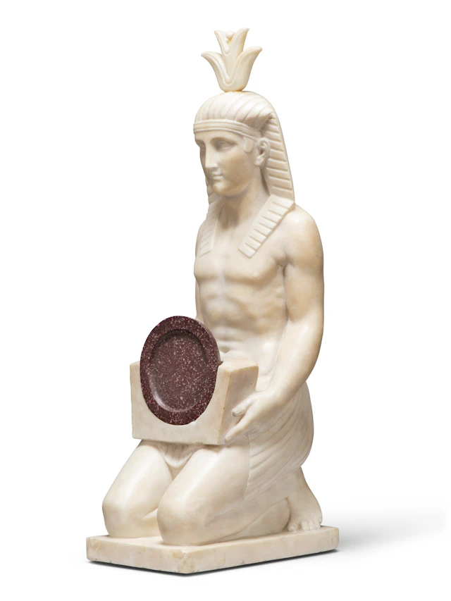 A Marble and Porphyry Figure of a Kneeling Egyptian Man