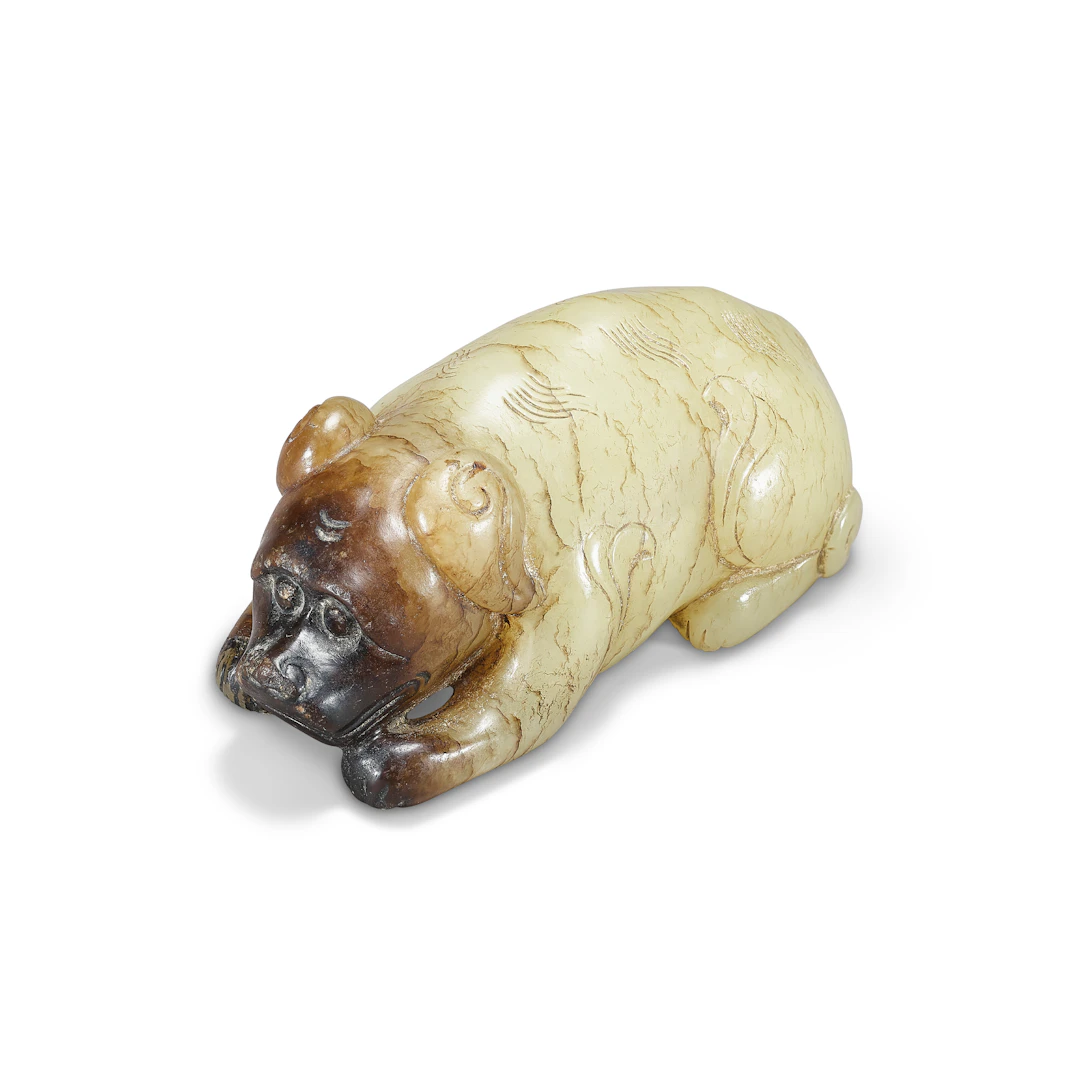 A Pale Yellow and Russet Jade Recumbent Dog